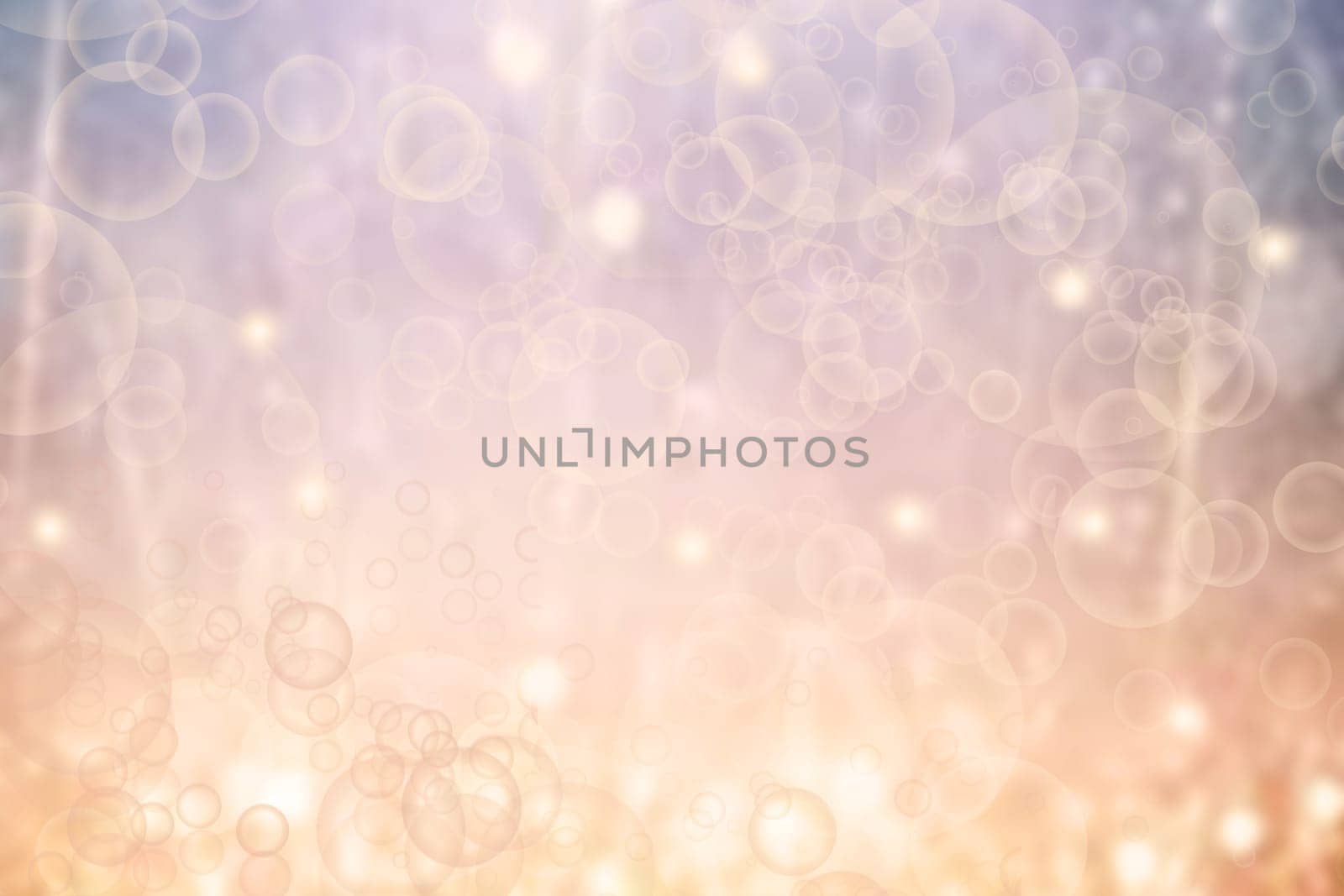 A festive abstract delicate Happy New Year or Christmas background texture with colorful gold yellow pink blurred bokeh lights and stars. Space for design. Card concept or advertising.