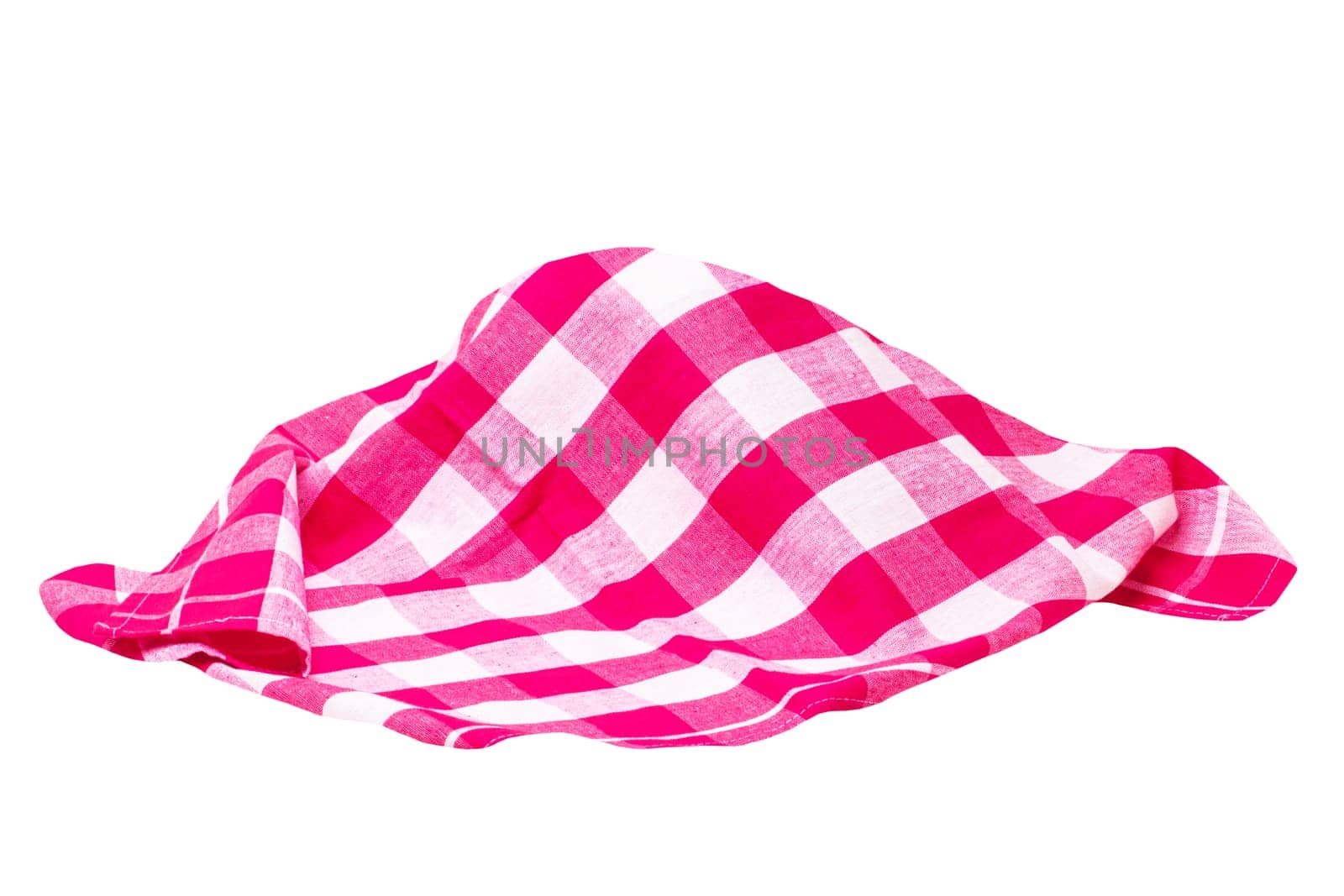 Closeup of a red and white checkered napkin or tablecloth texture isolated on white background. Kitchen accessories. Top view.