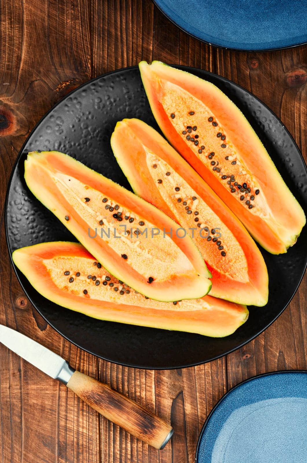 Sliced sweet juicy papaya on the table. Beautiful papaya fruits.