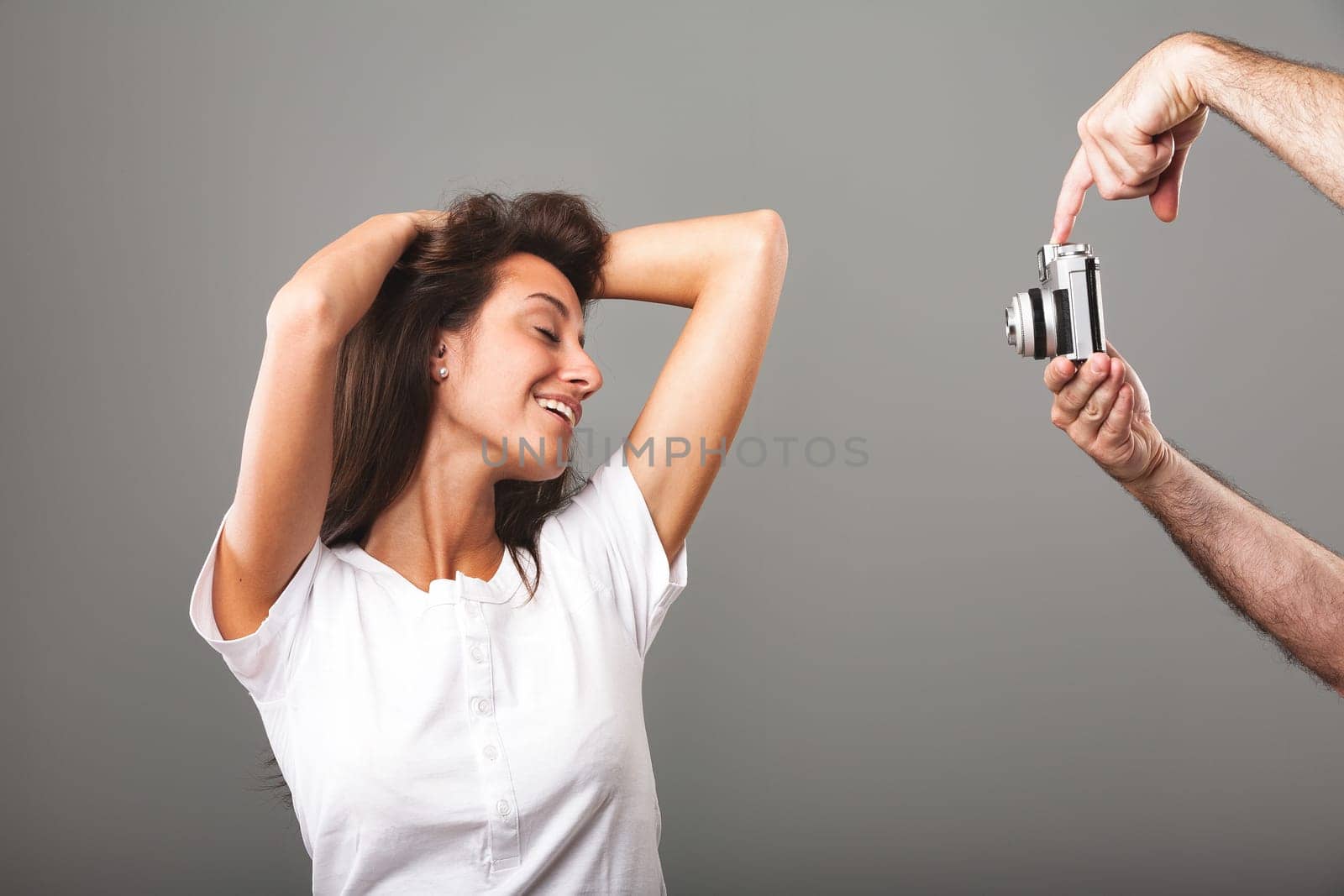 Young woman playfully pouts, flirting with the camera. Aiming for a captivating photo, she poses sensually, alluring, coy, and charmingly radiant. Adorably sexy, attractive, long-haired, slim