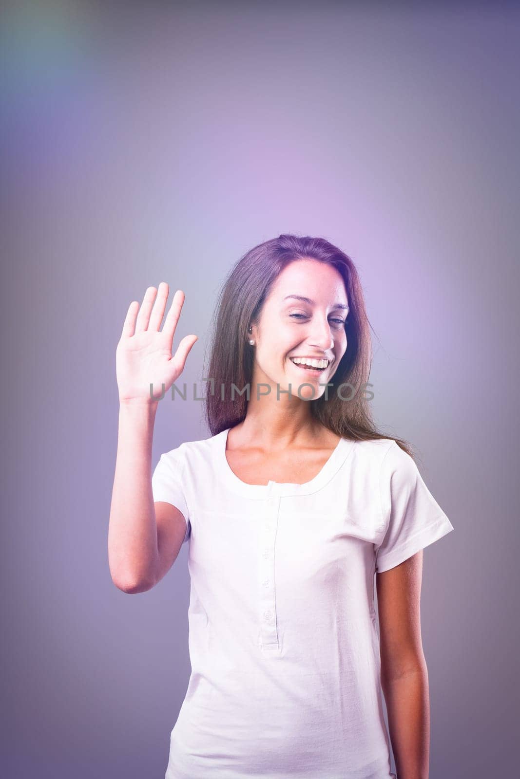 Thin woman in white tee, viewed via psychedelic lights, mildly intoxicated look, symbolizing perception change due to substances or alcohol overuse, consumed for an uplift