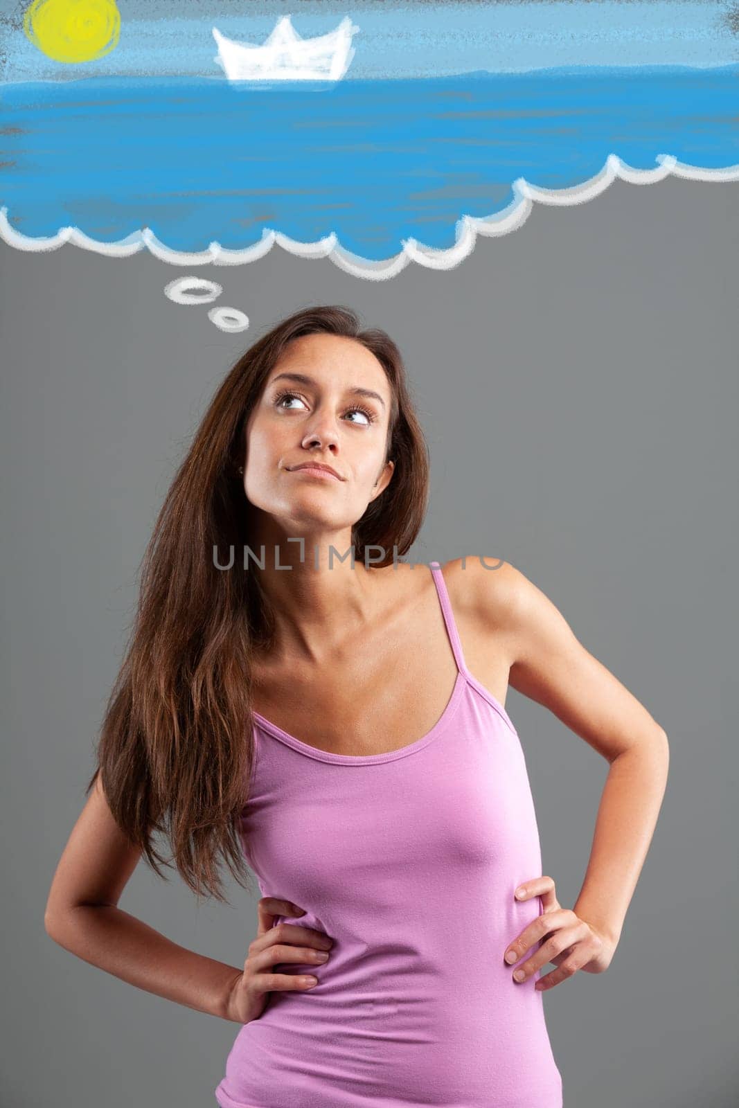 slender young woman with long hair wears a pink tank top  she has her arms akimbo and her hands resting on her hips while a graphic effect shows her dreaming of the sea and vacations