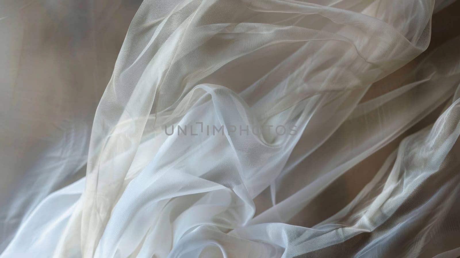 A white fabric is seen in a blurry state, gently draped over a surface. The soft texture of the fabric creates a delicate and subtle visual effect.