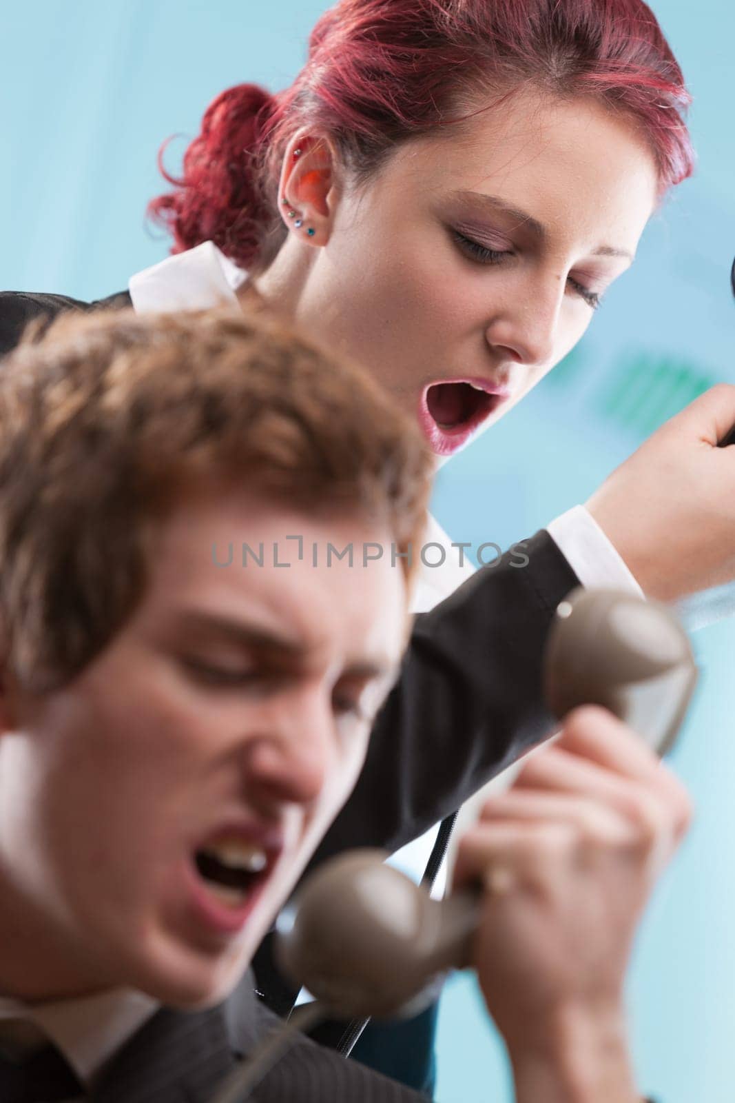 Chaos in the call center! Trained staff in business attire managing intense phone conversations
