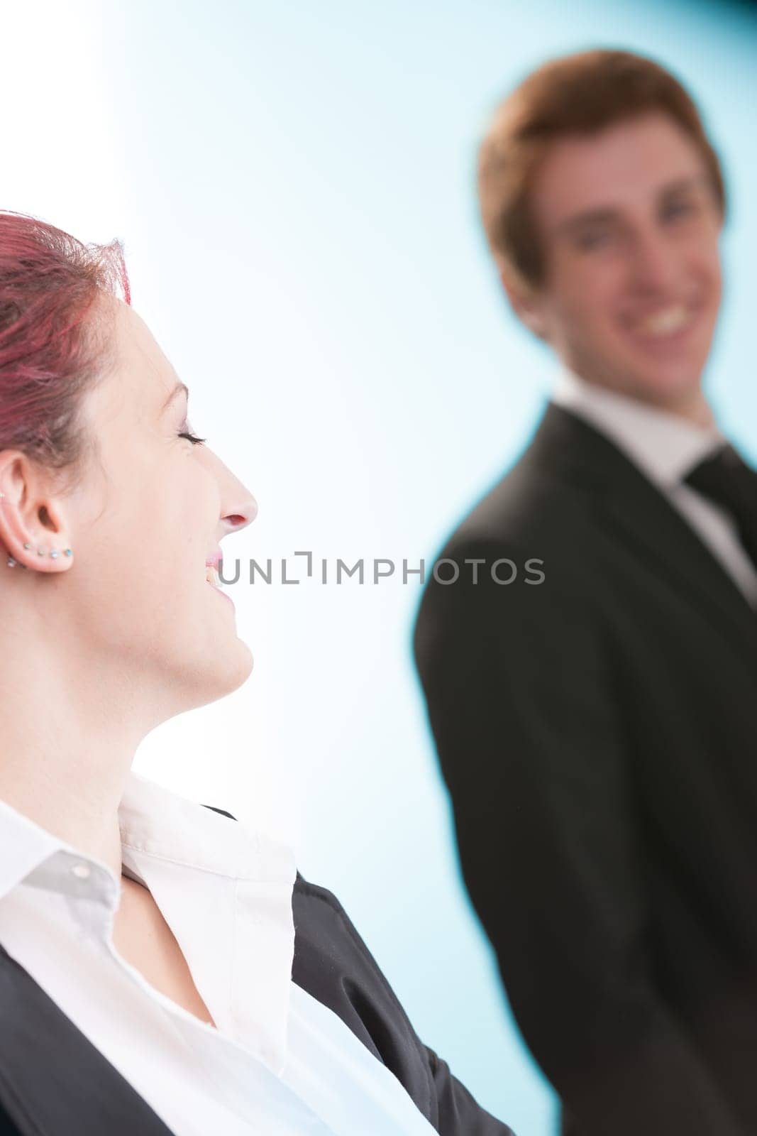 oung man and woman, lost in a shared gaze in an office. Business roles blur in the face of budding romance. Their humanity is undeniable