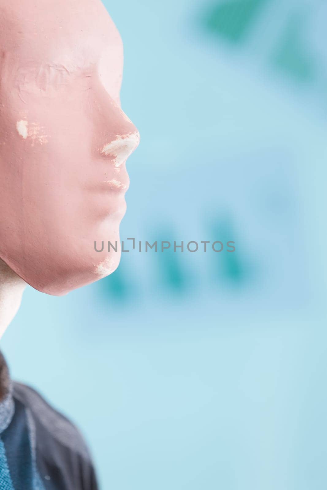 man with a blank mask, disconnected from reality, symbolises the relentless advancement of incomprehensible technology.