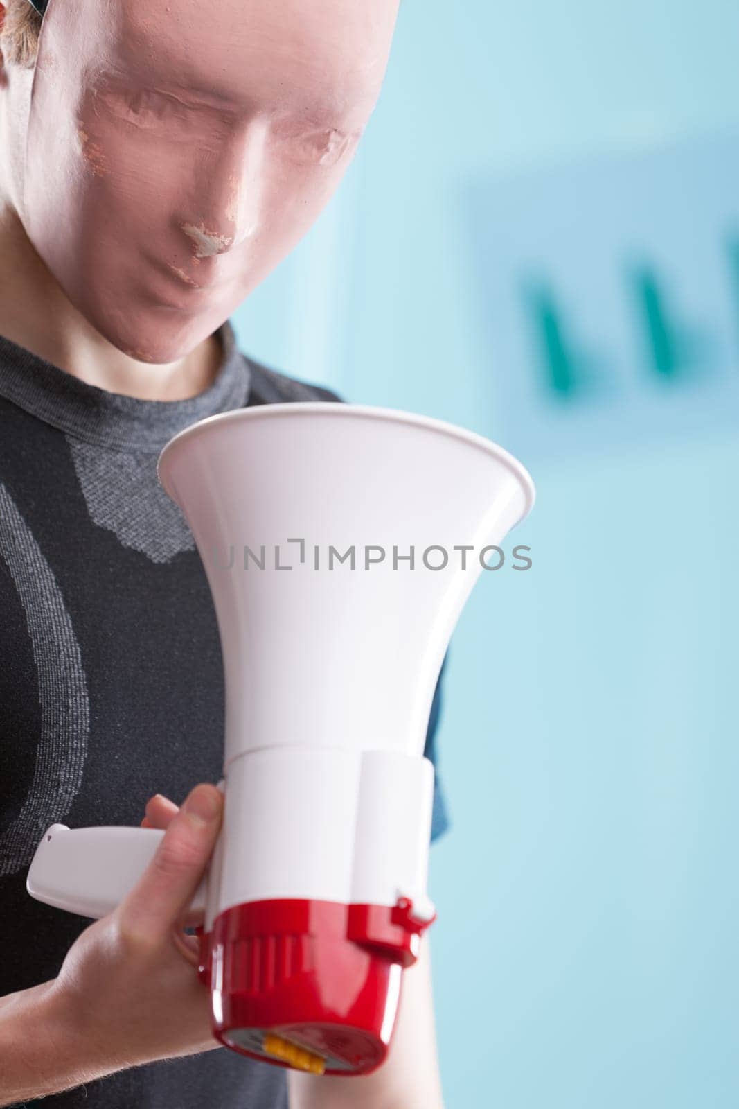 Faceless man with purposeless tools symbolizes the solitary struggle against rapid technological advancement