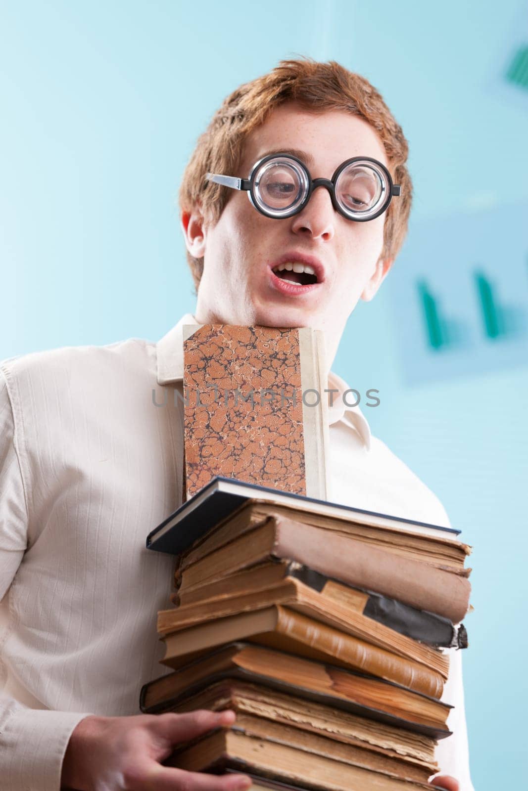 A socially awkward nerd laden with books, encapsulating the stereotype of knowledge yet lacking social skills