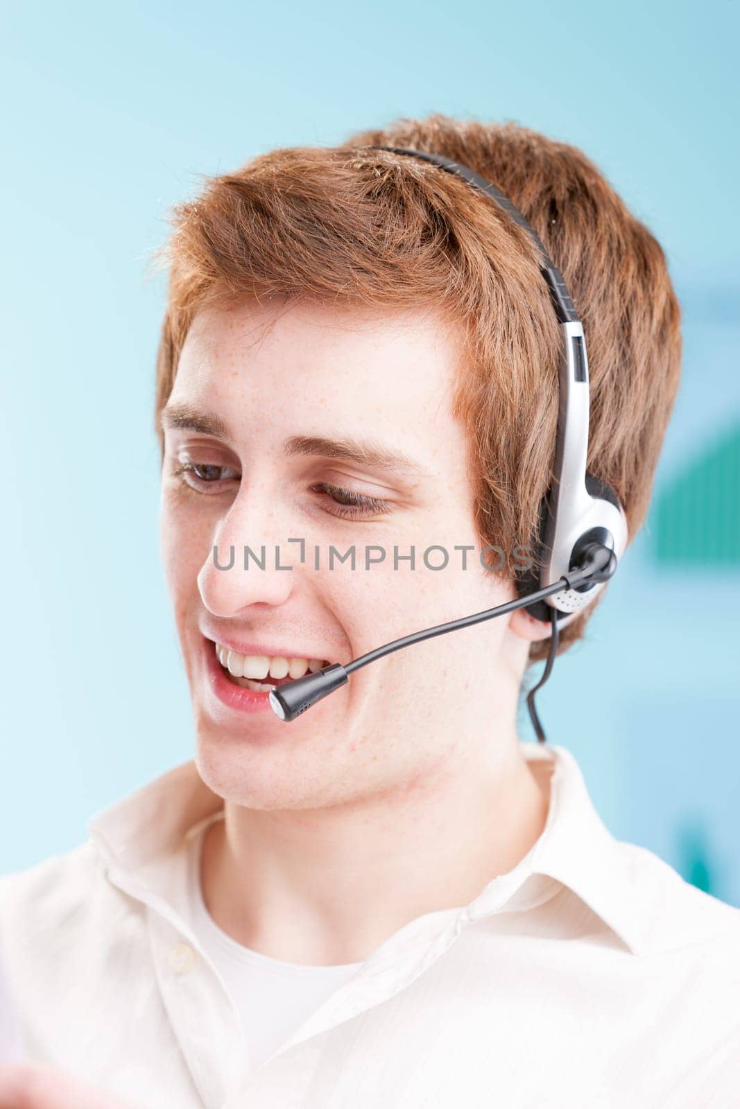 Red-haired call center agent, productivity charts looming in the blur. Portraying the real struggle