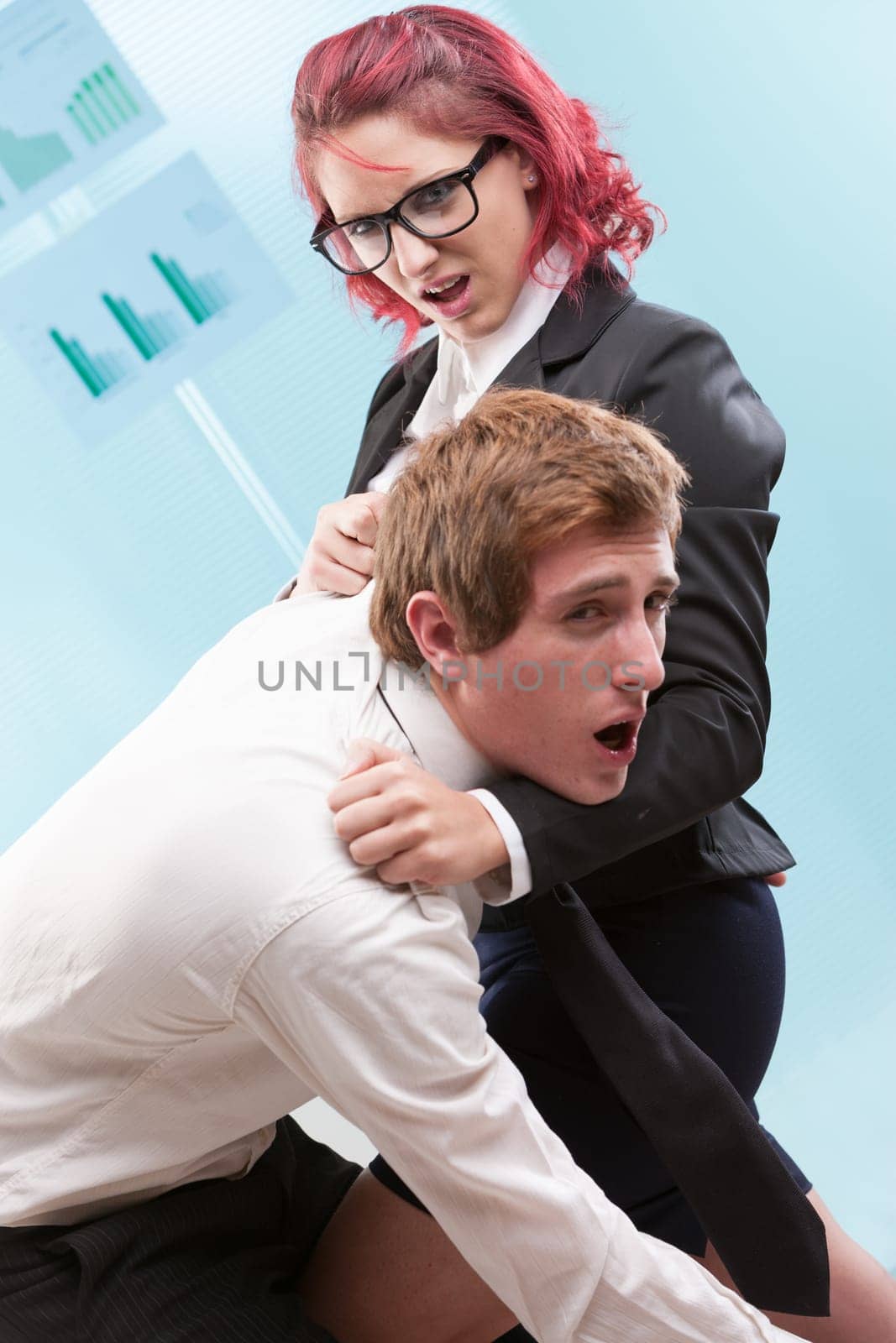 Workplace violence: Woman physically mistreating a man. Excessive power often leads to its misuse