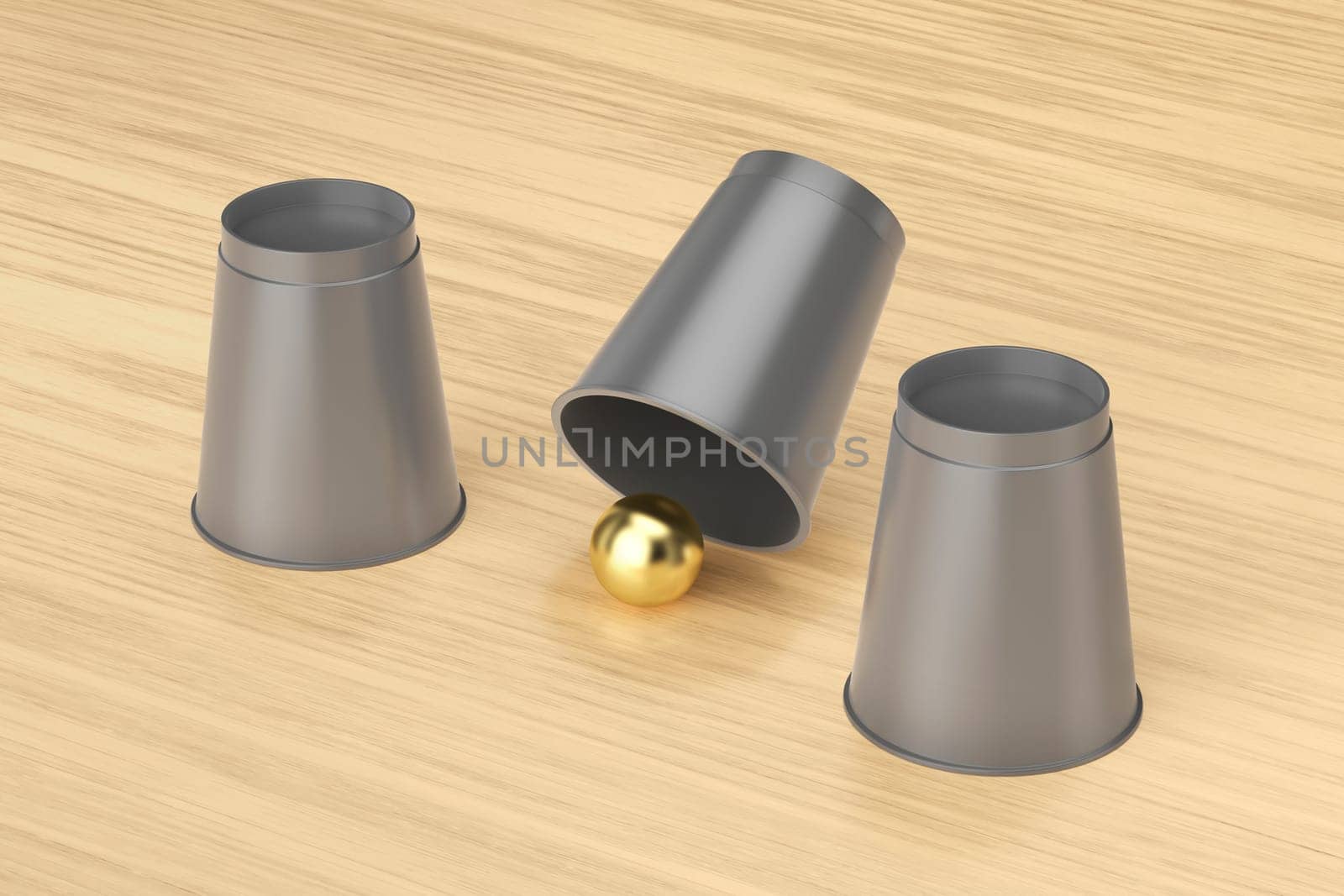 Magic trick with three cups and a gold ball
