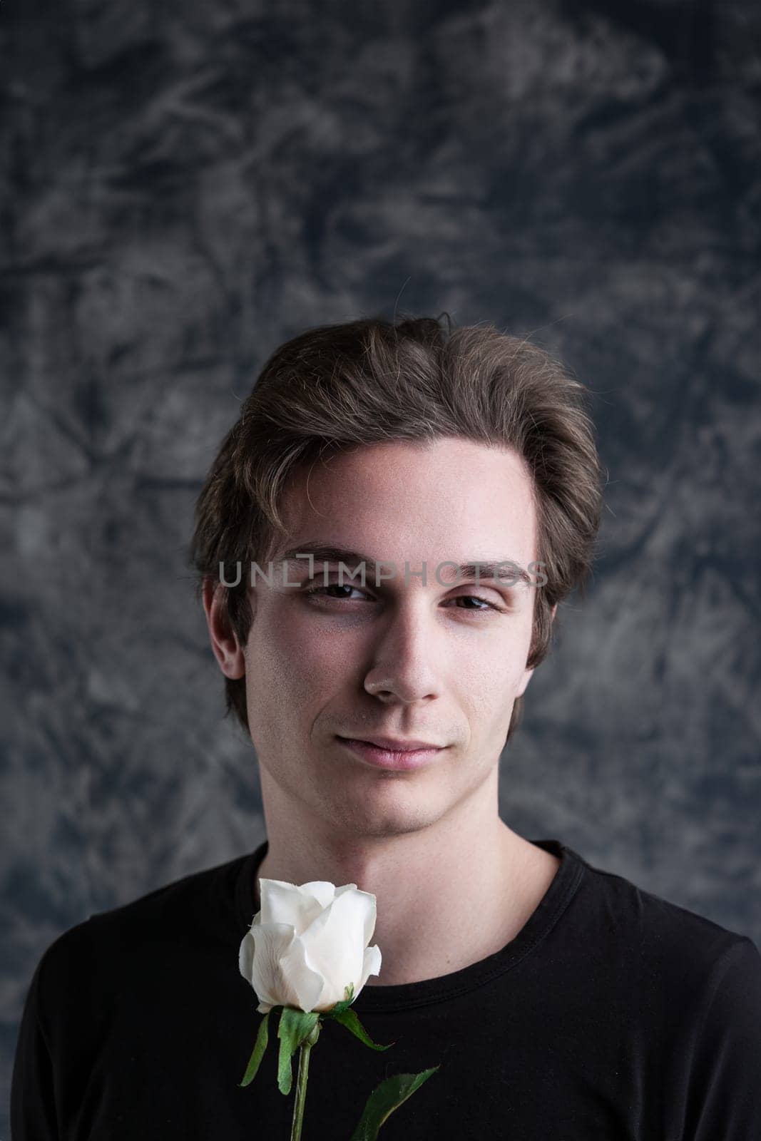 white rose extended, a man's languid eyes tell stories. Amidst grunge, love and romance intertwine, but is there an undercurrent of covert narcissism?