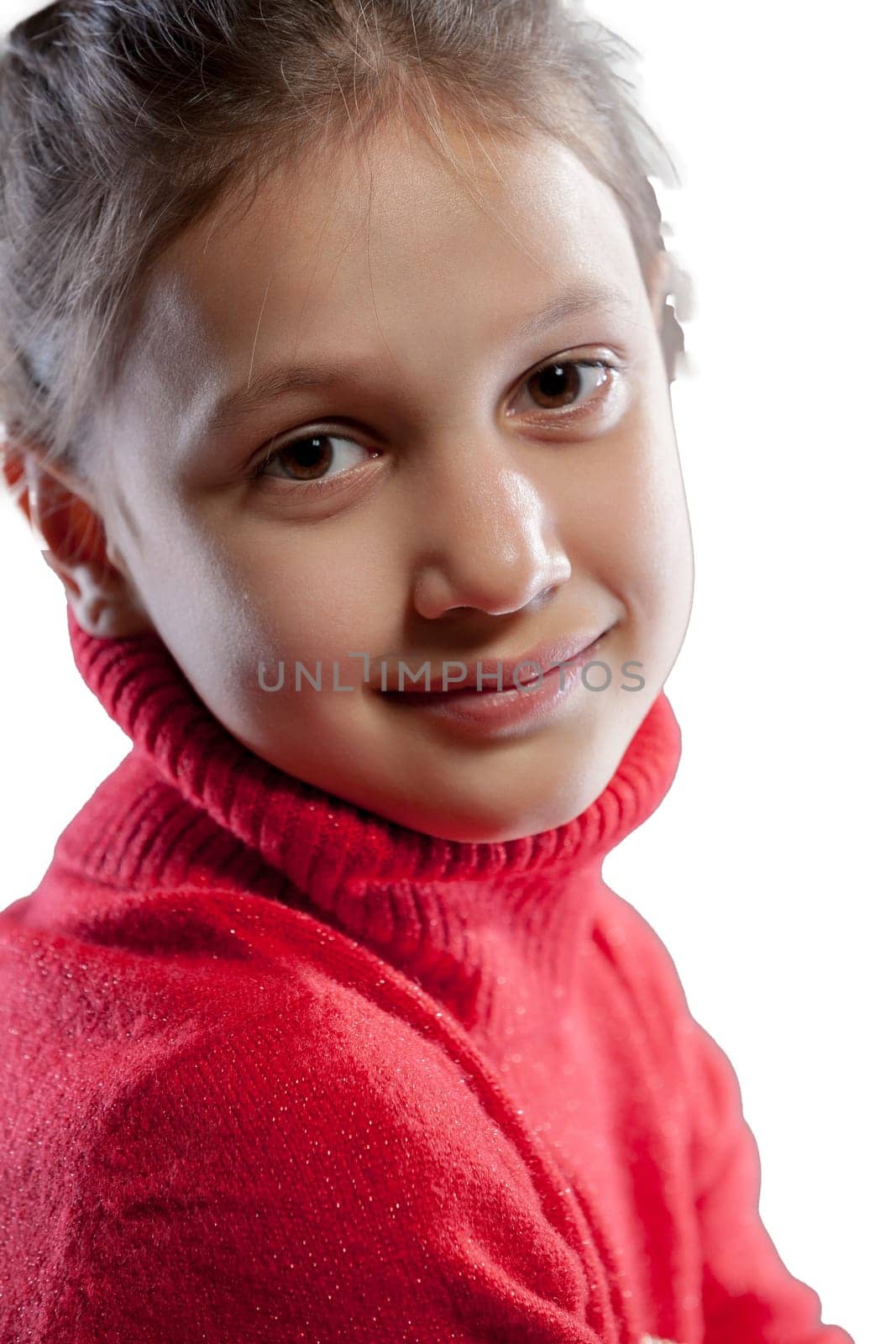 In a side view, a close-up shot captures a girl with a sweet yet melancholic gaze, under harsh top light. Her red sweater stands out against the white backdrop