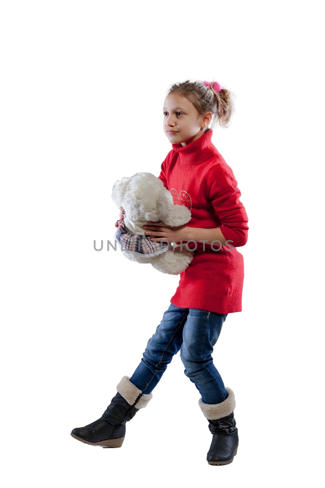Loving her white teddy bear, a girl in a red sweater explores play, friendship, cuddles, hugs, and tosses - a reassuring soft presence