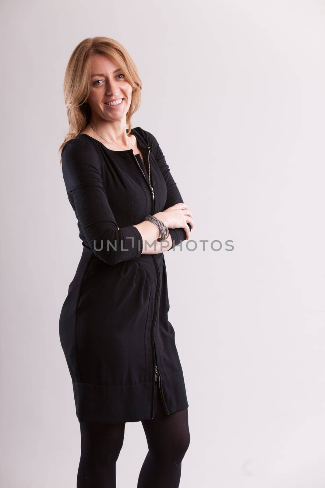 Radiating contentment, a woman finds joy in her life's riches. This happiness resonates outward, reflecting the cycle of breath. With gratitude, she upholds personal growth as shared enrichment, not a