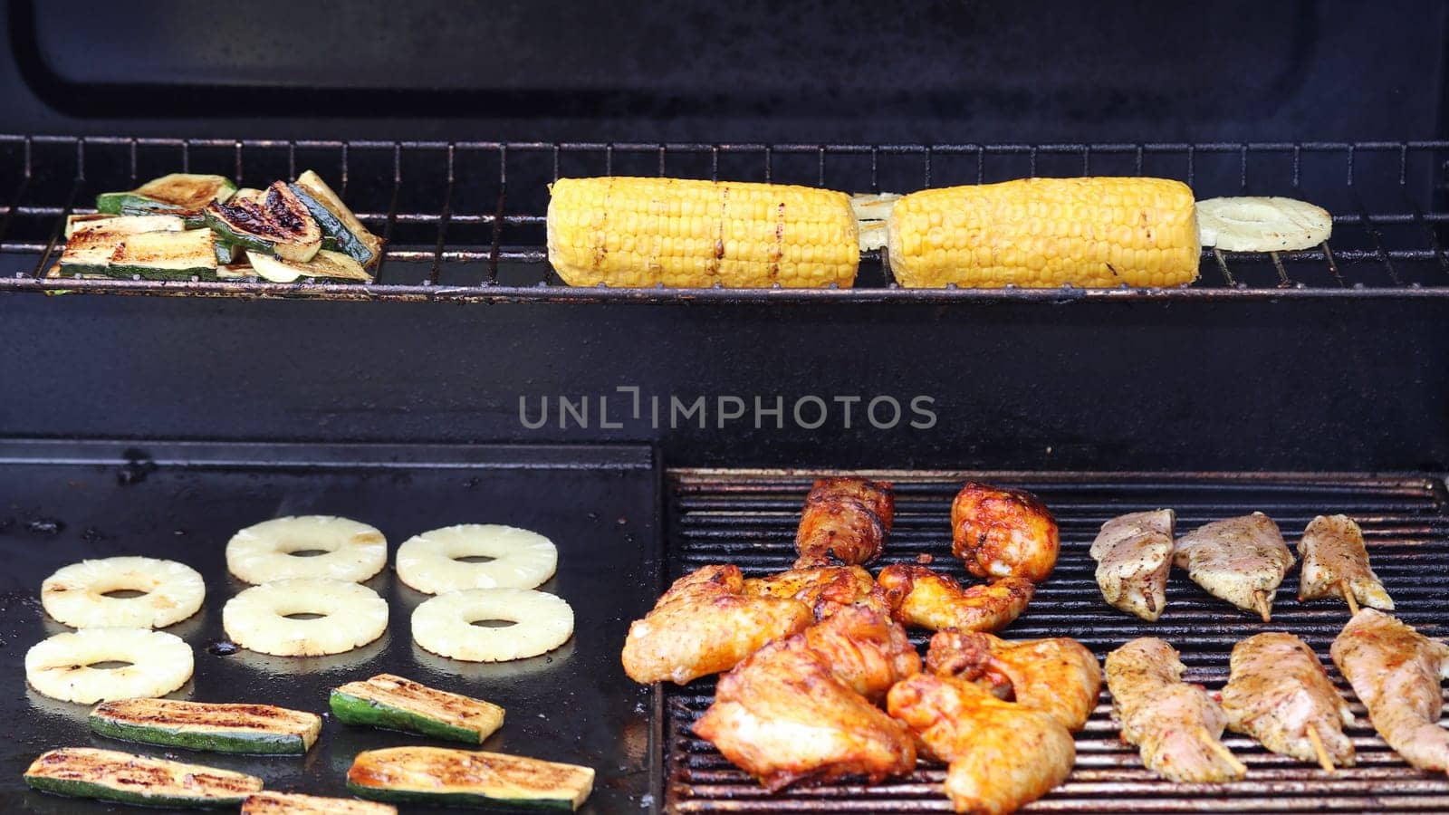 Several pieces of grilled meat on a grill