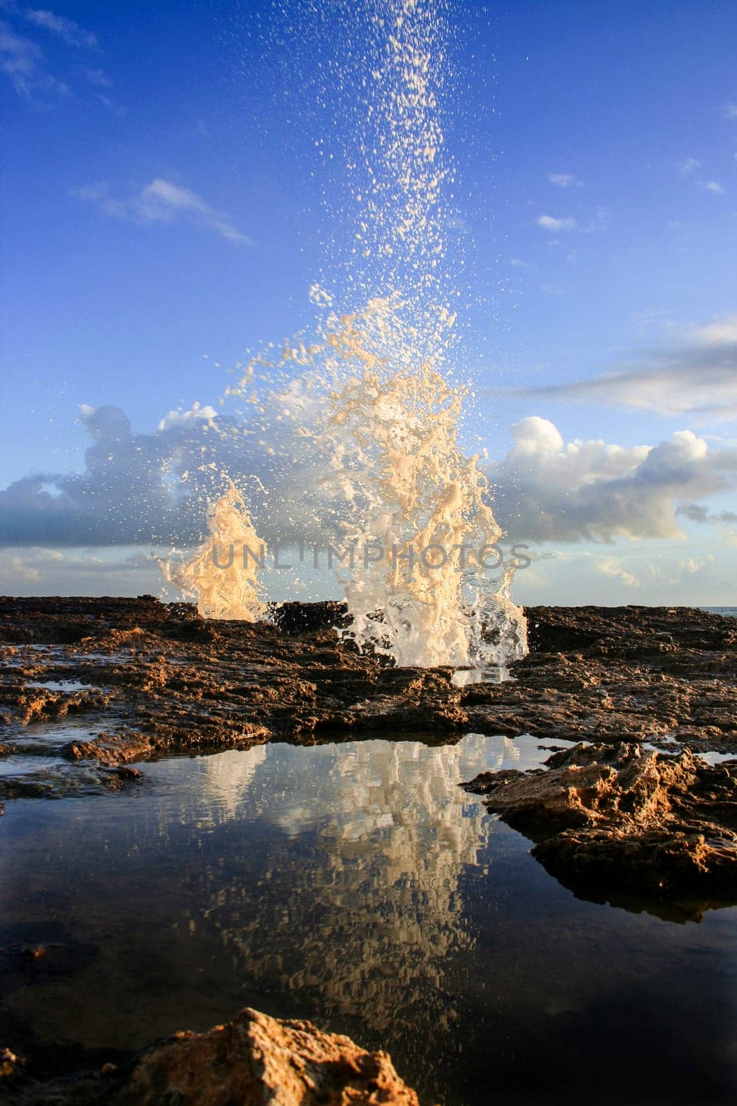 Blowholes at Cadiz city coastline sending burst of water high into the air, Spain