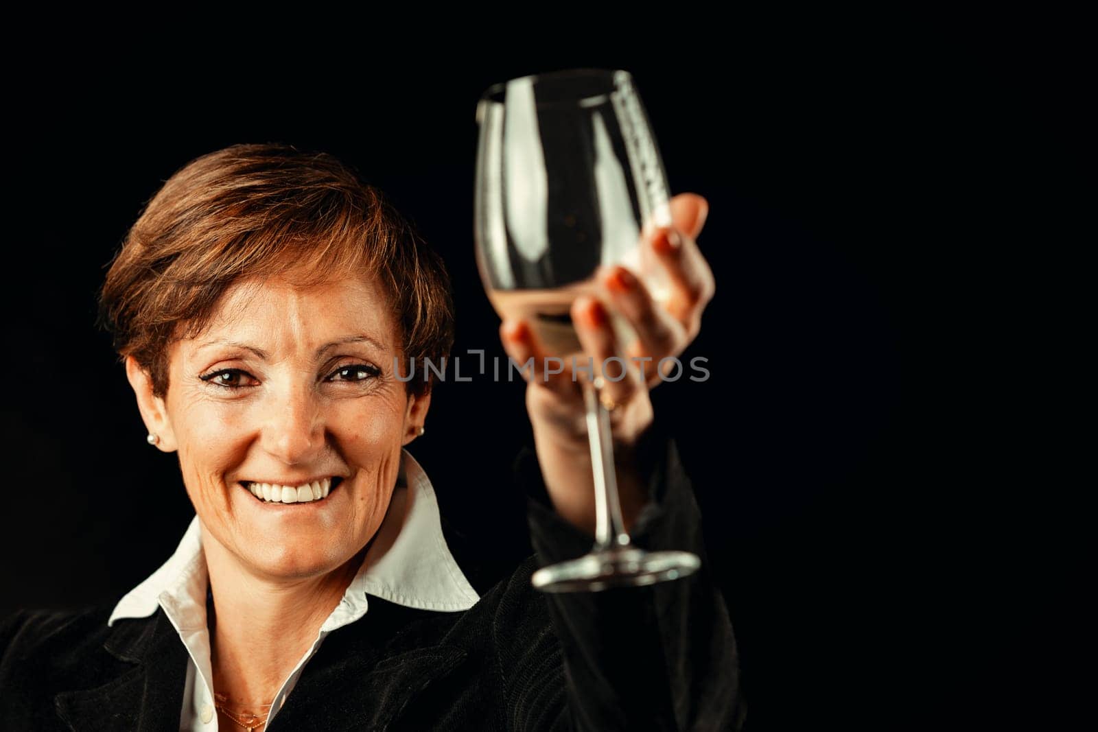 'Drink a fine white wine!' suggests an elegant elderly lady. Raising a glass of white wine, she toasts to health and relishes millennia-old European wine culture, now global. Despite alcohol's carcino