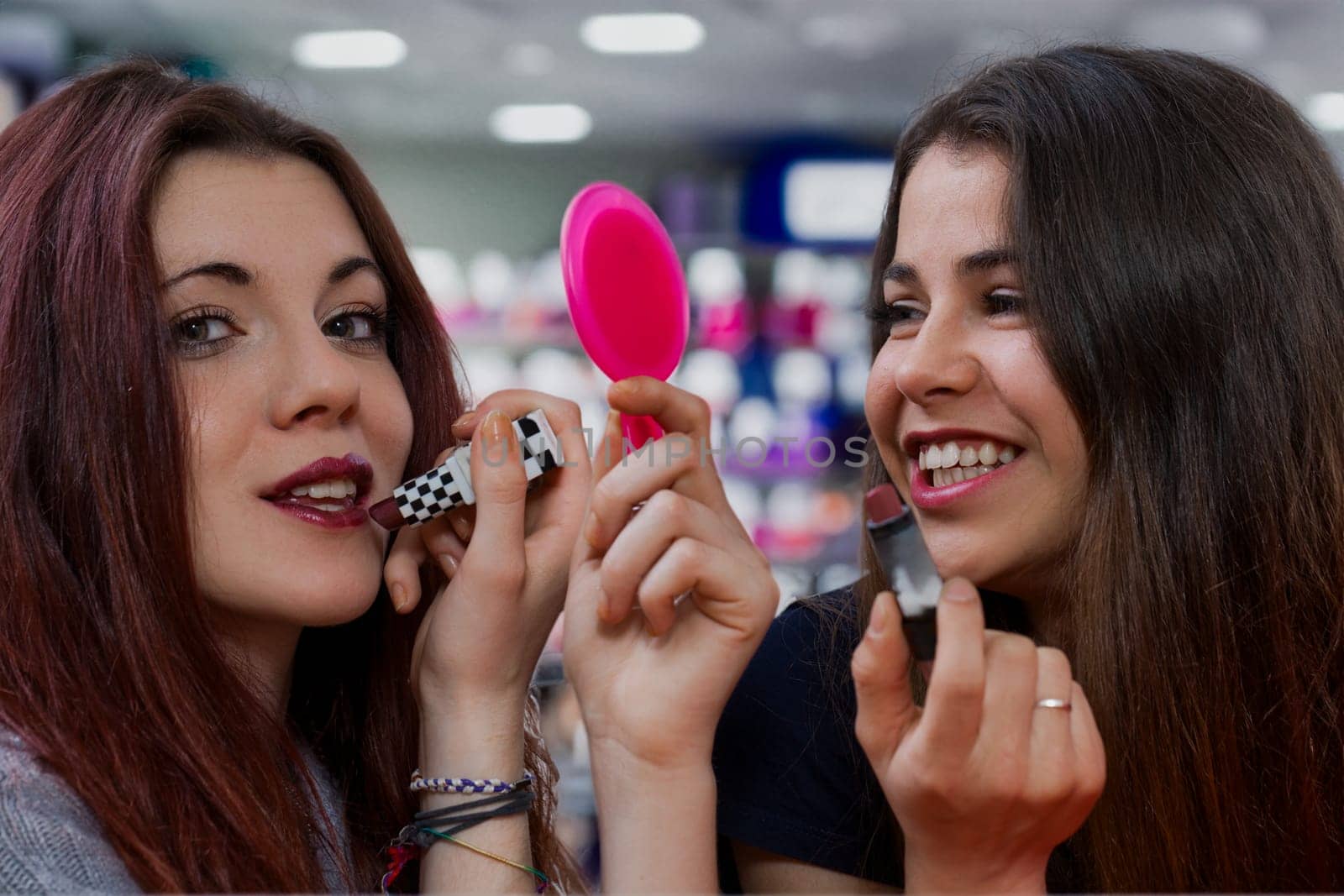 Two stunning young women apply makeup, prepping for dates, supporting each other wholeheartedly. Their friendship is strong now, but life's unpredictability looms. For the moment, they embrace fun, se