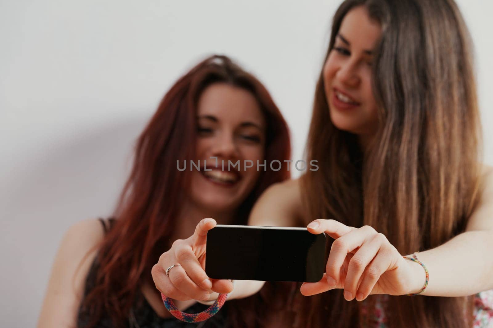 While enjoying their beauty and smartphones, they remain conscious of society's future judgmental gaze