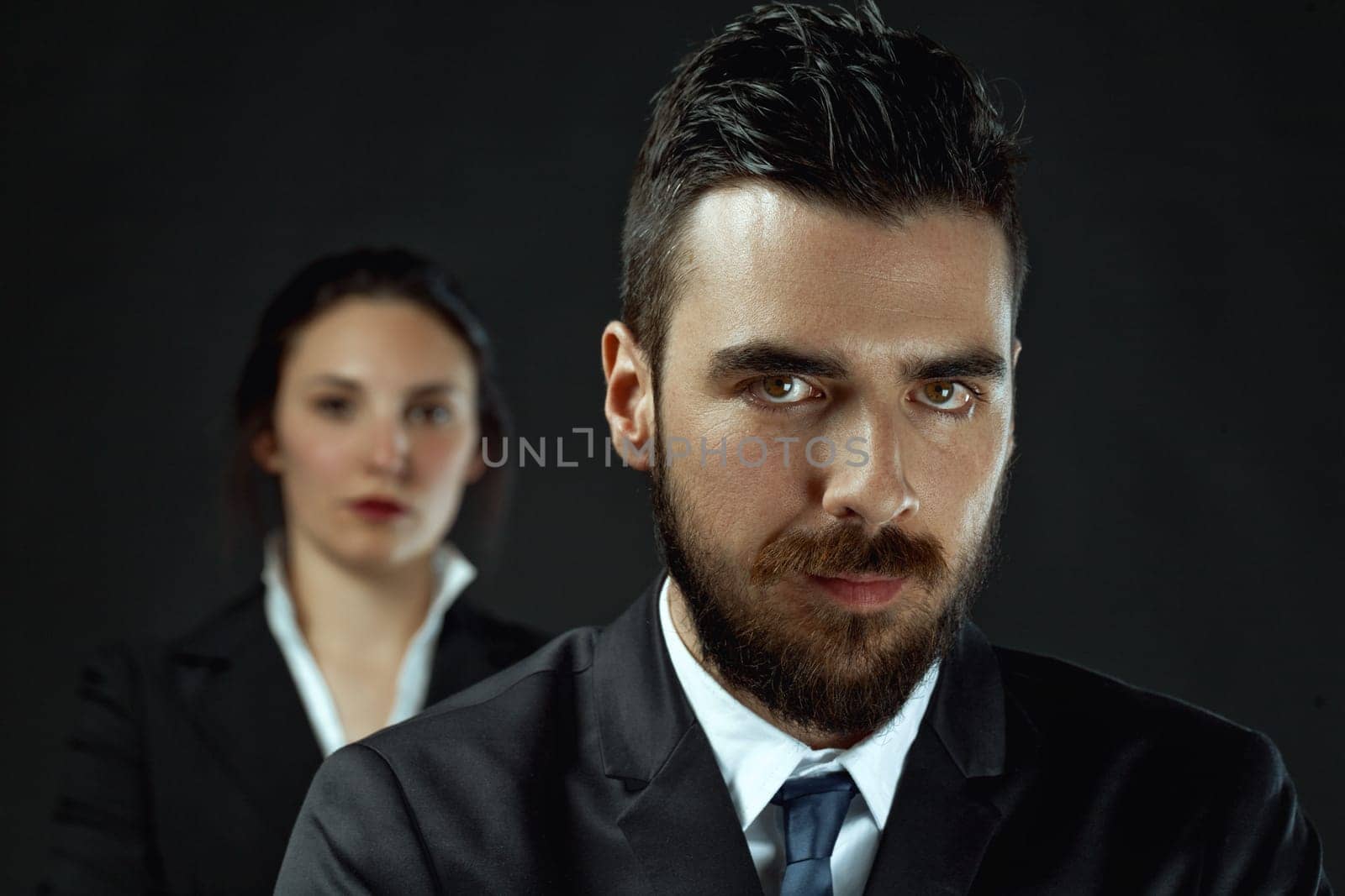 intense man and potentially stronger woman as officials, illustrating the importance of deciding alliance or opposition in achieving victory