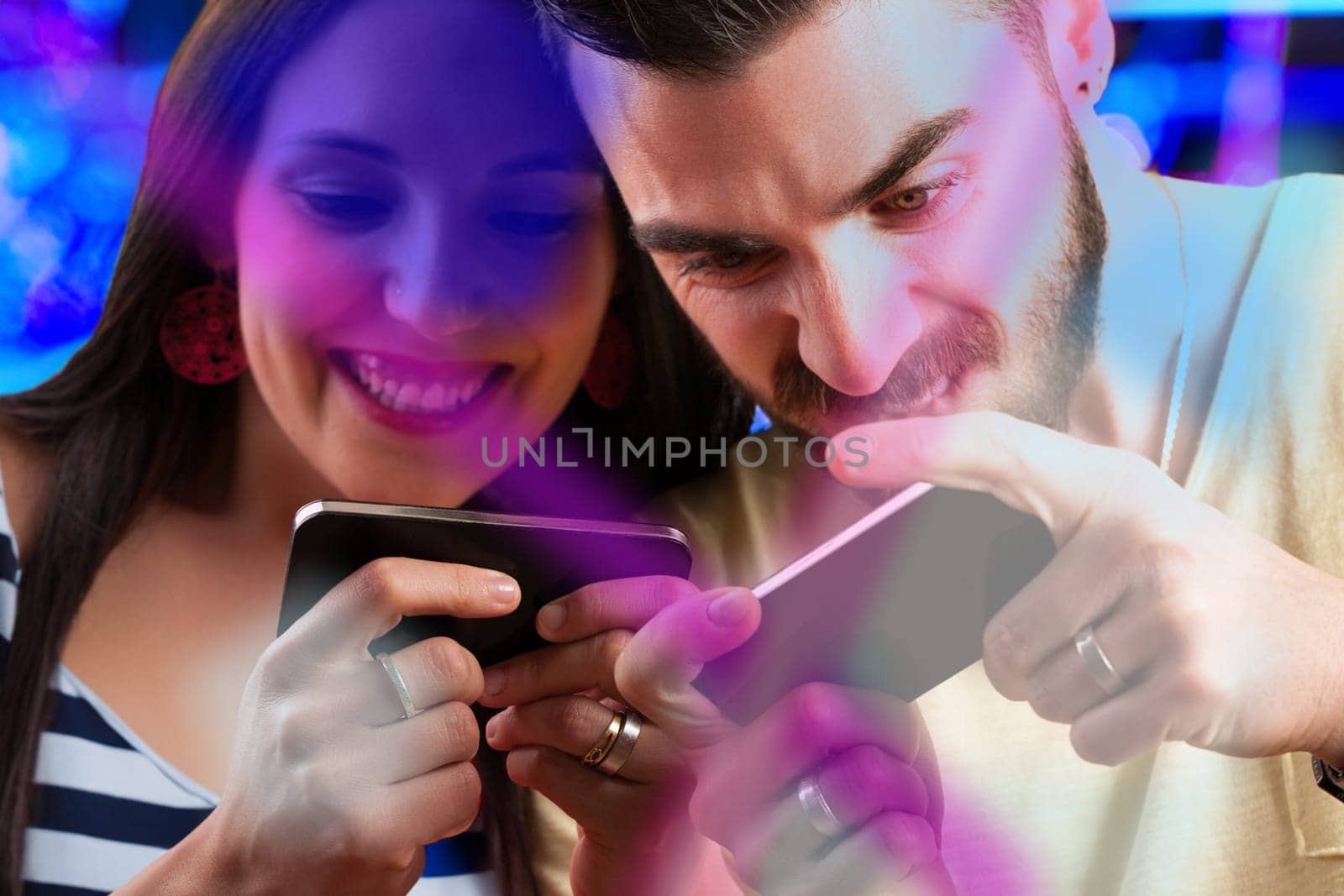 couple competes in a video game on smartphones. Ill win! she exclaims. He retorts, Think again, watch this! Beyond useful apps and access to human knowledge, smartphones have also repla