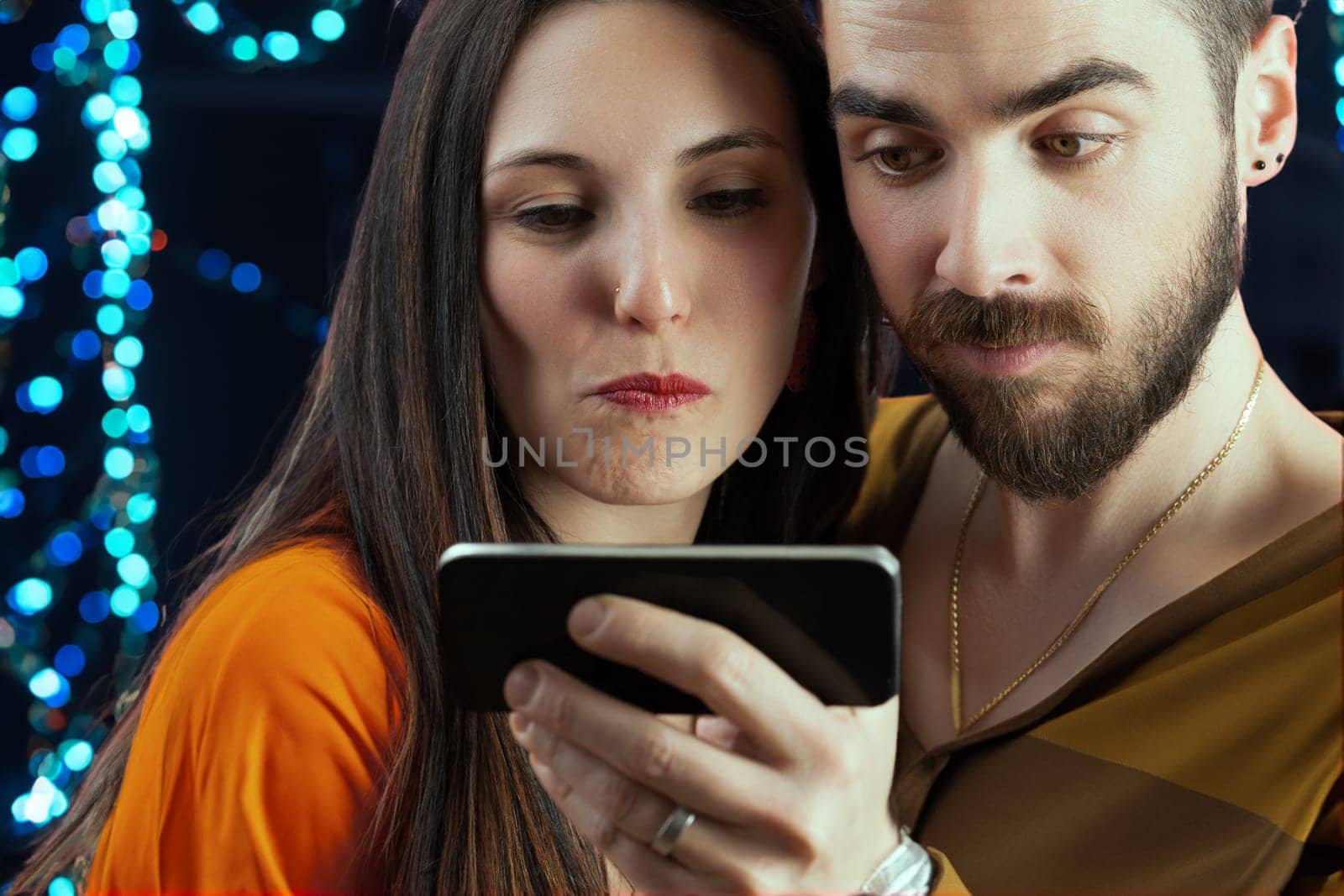 man and a woman, gleefully taking a selfie during their vacation night amidst city or party lights. Enjoying vacations feels like truly living, making the return to mere survival something to be kept