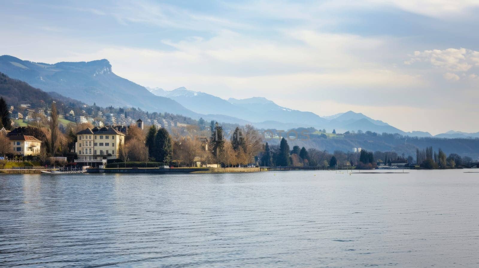 This scene showcases a stunning body of water nestled amidst towering mountains and lush trees. The water reflects the grandeur of the mountains and the tranquility of the dense forest surrounding it.