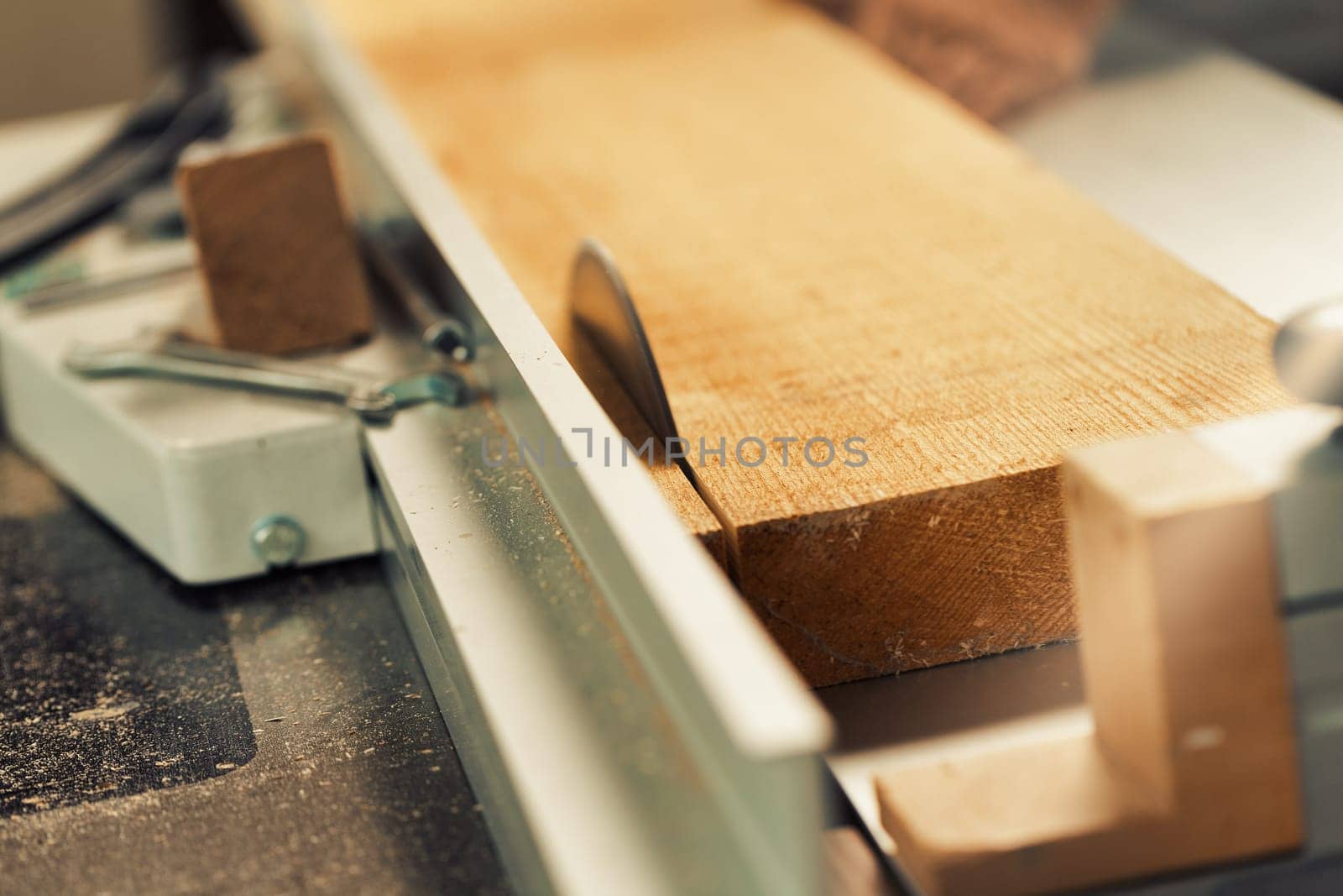 Wood saw while cutting lumber in a woodworking shop.