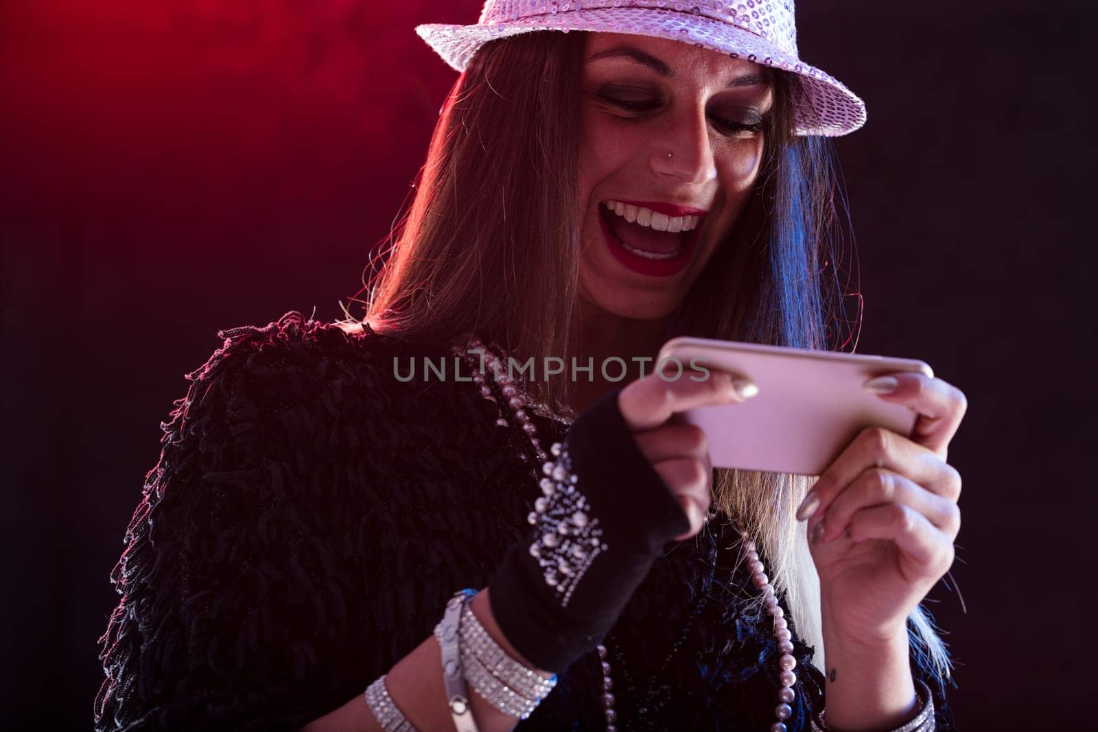A young lady envisions herself as a performer, engrossed in a live show on her phone. She's incredibly moved by the dance video or pop concert. Yeah!