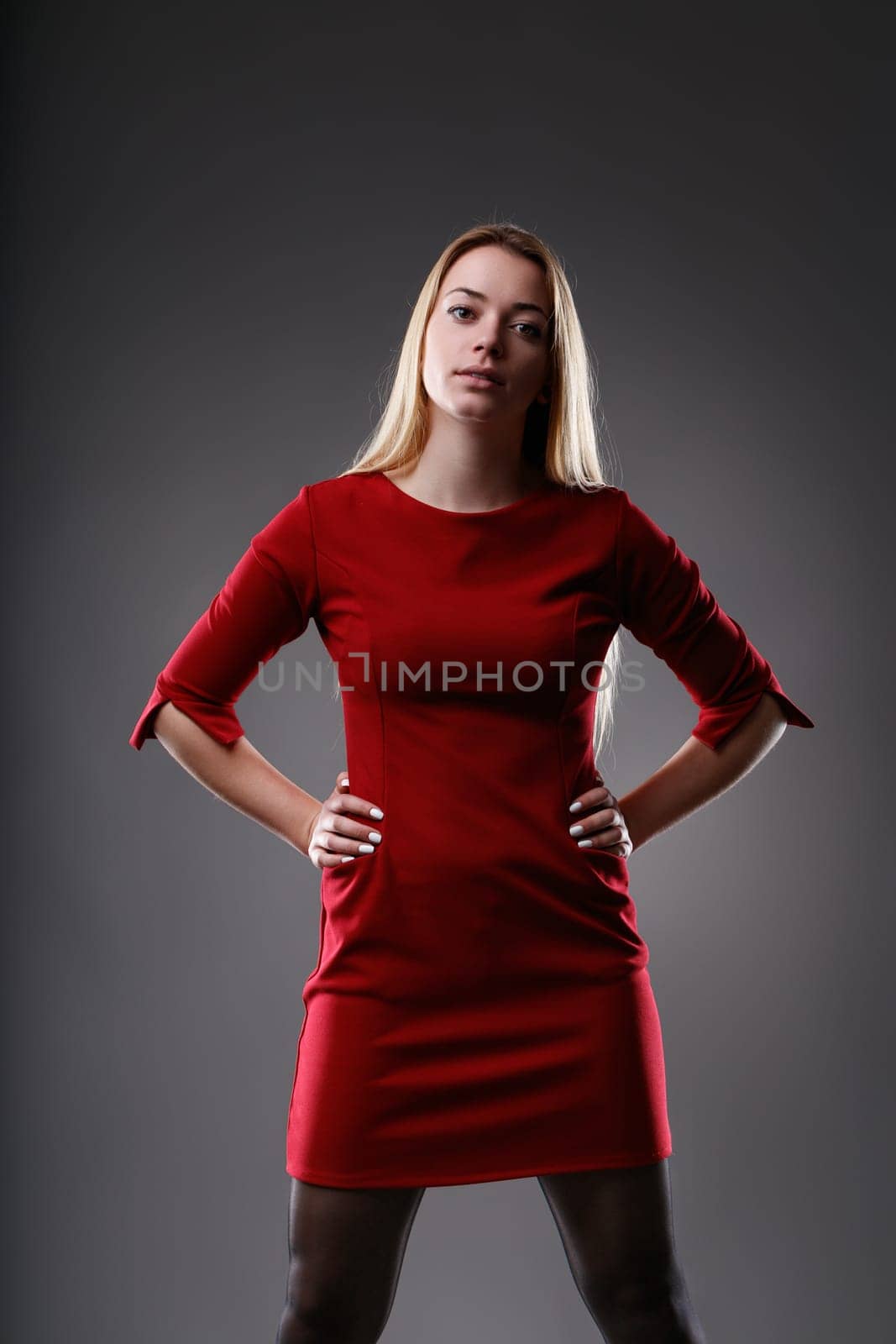 The woman's direct gaze and authoritative posture speak of confidence and power