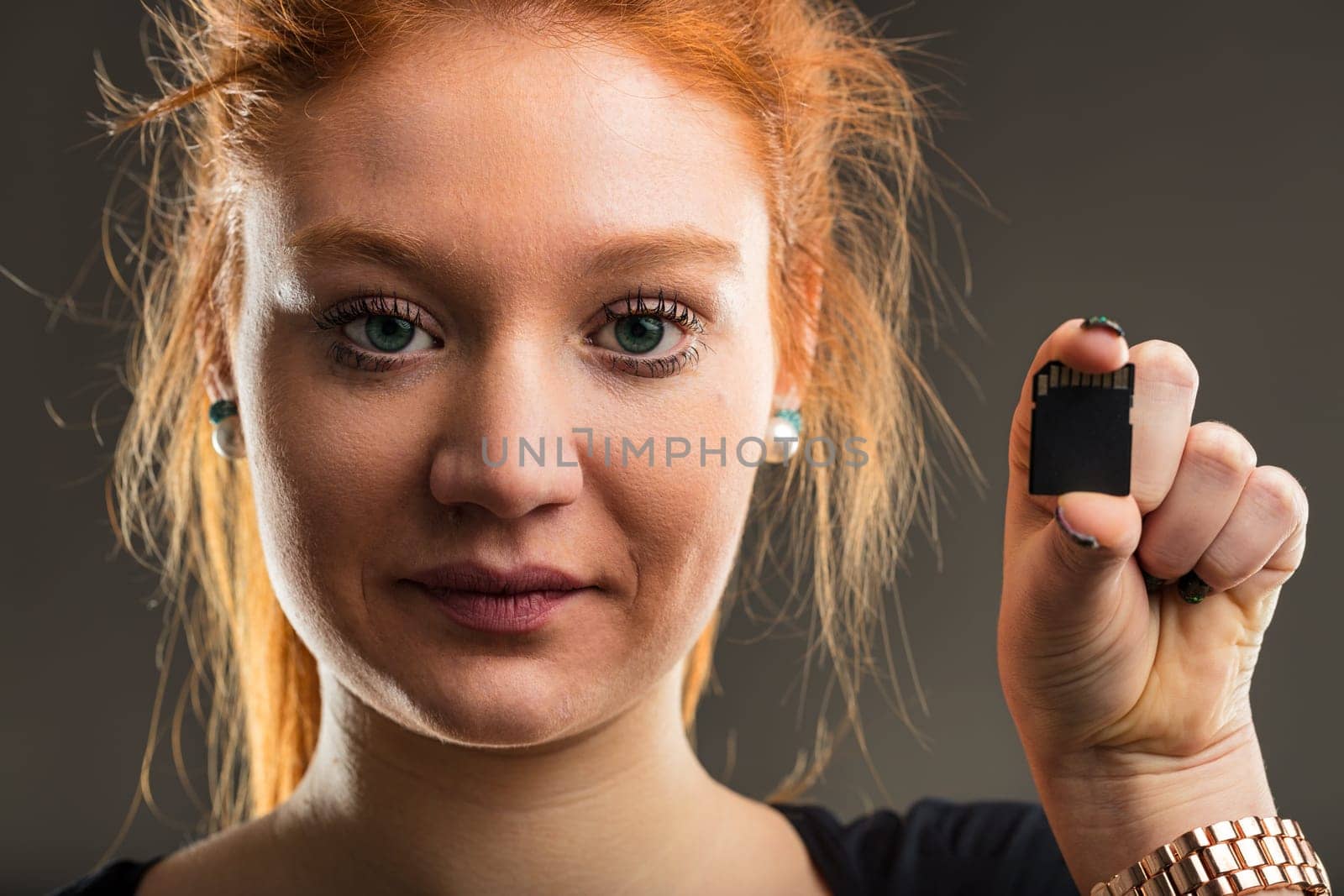 Expert in digital storage presents a micro SD card, symbolizing the vast potential of compact technology