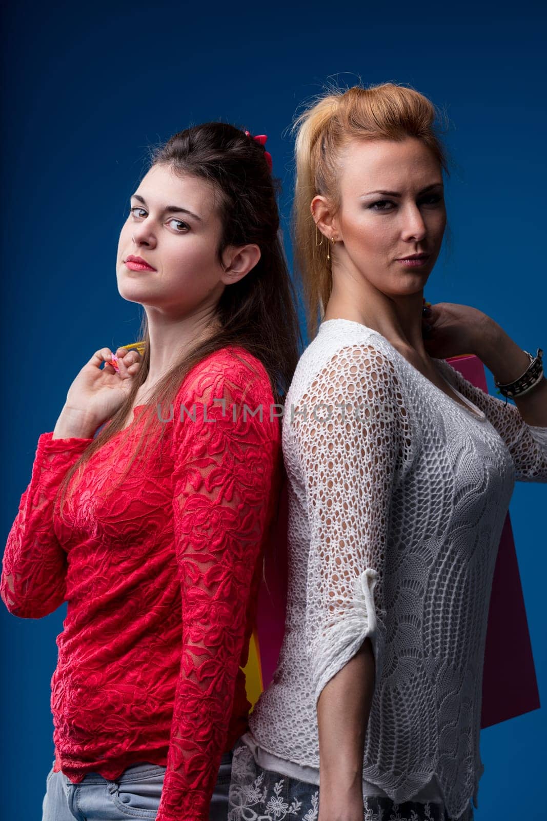 Expert in style and economy, two young women question traditional shopping methods