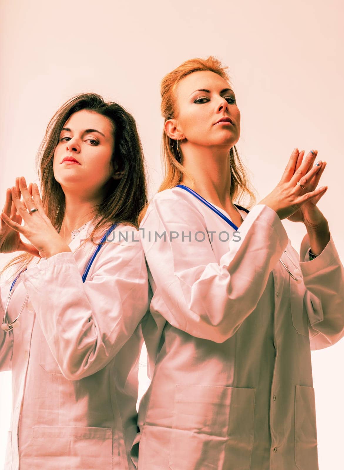Two daunting doctors embody menace with their stern postures, exuding a dark aura