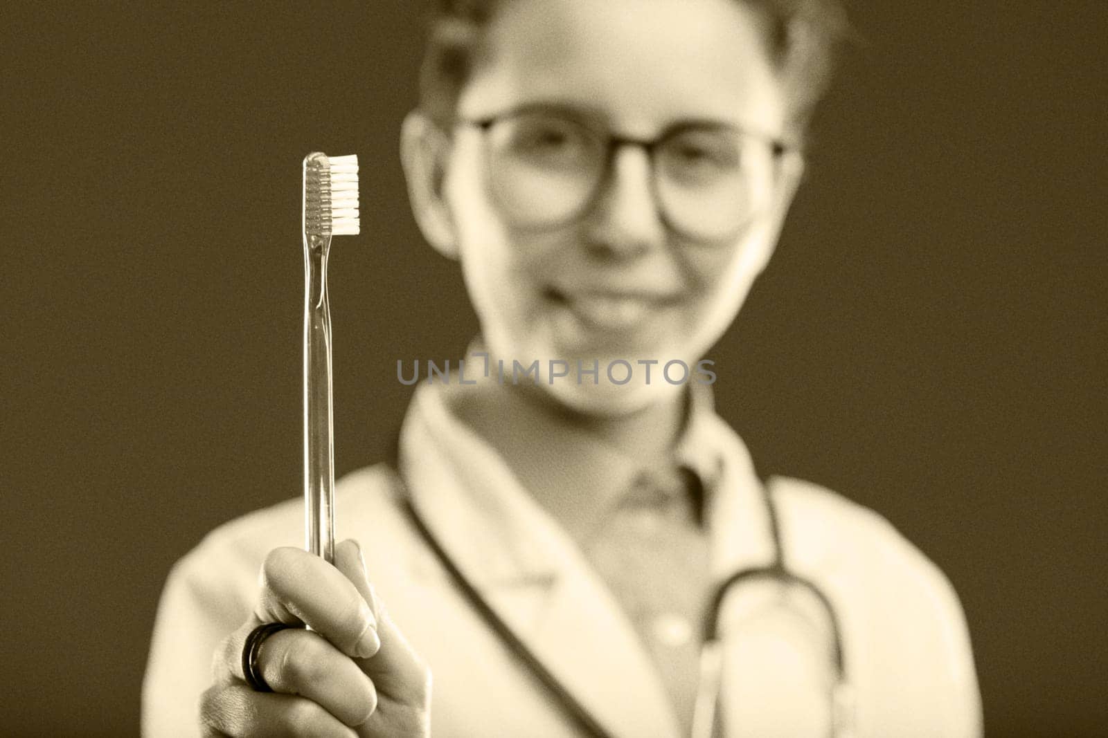 toothbrush is centered in this vintage-styled photograph, suggesting timeless dental hygiene