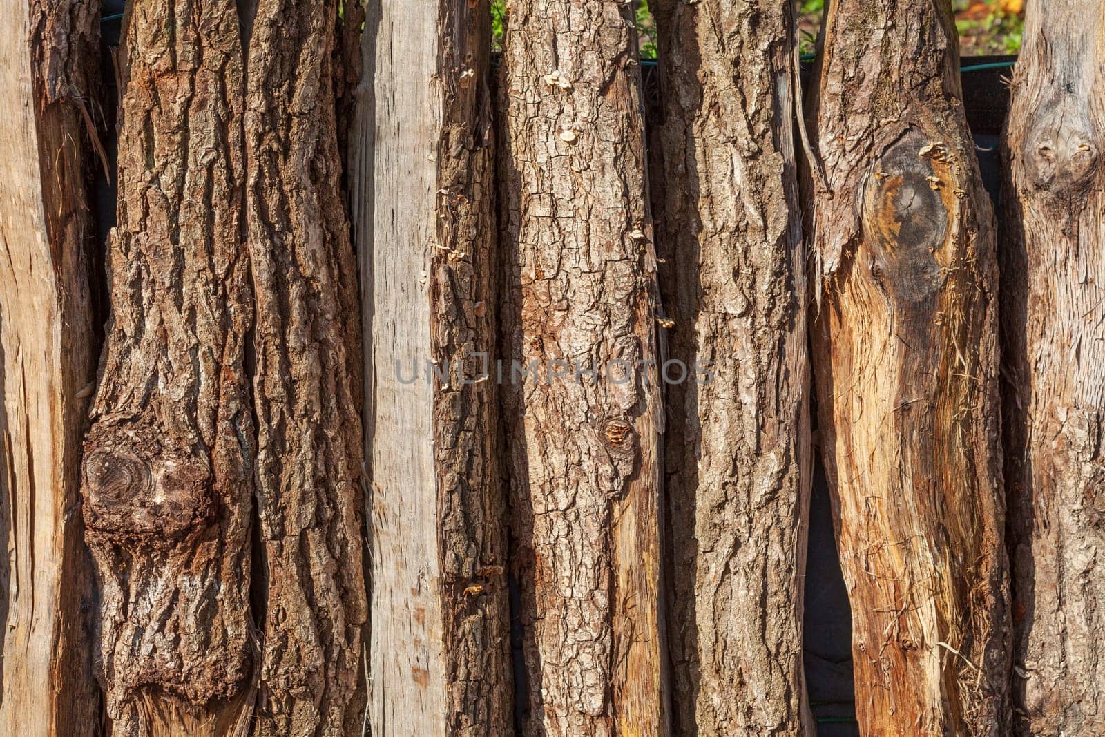Brown wooden board fence with fence posts, Germany