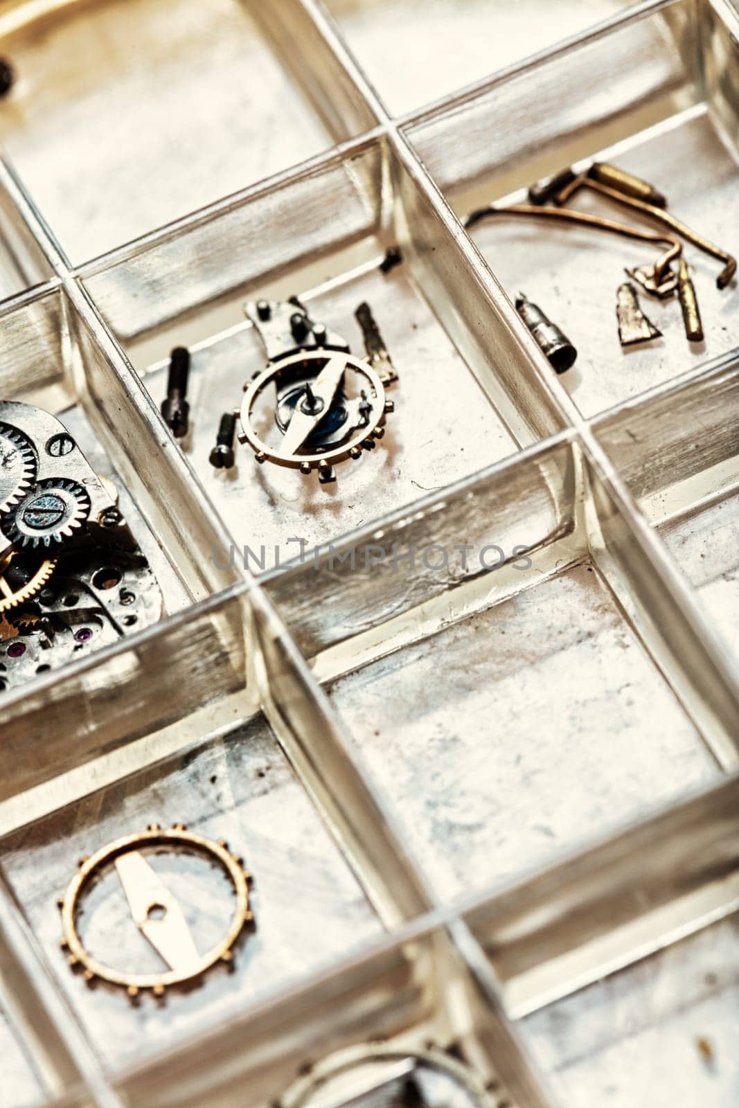 Artisan's table with watches, gears, springs. Steampunk mood, fusion of technology, aesthetic taste, and status symbol. Close details, shallow depth of field