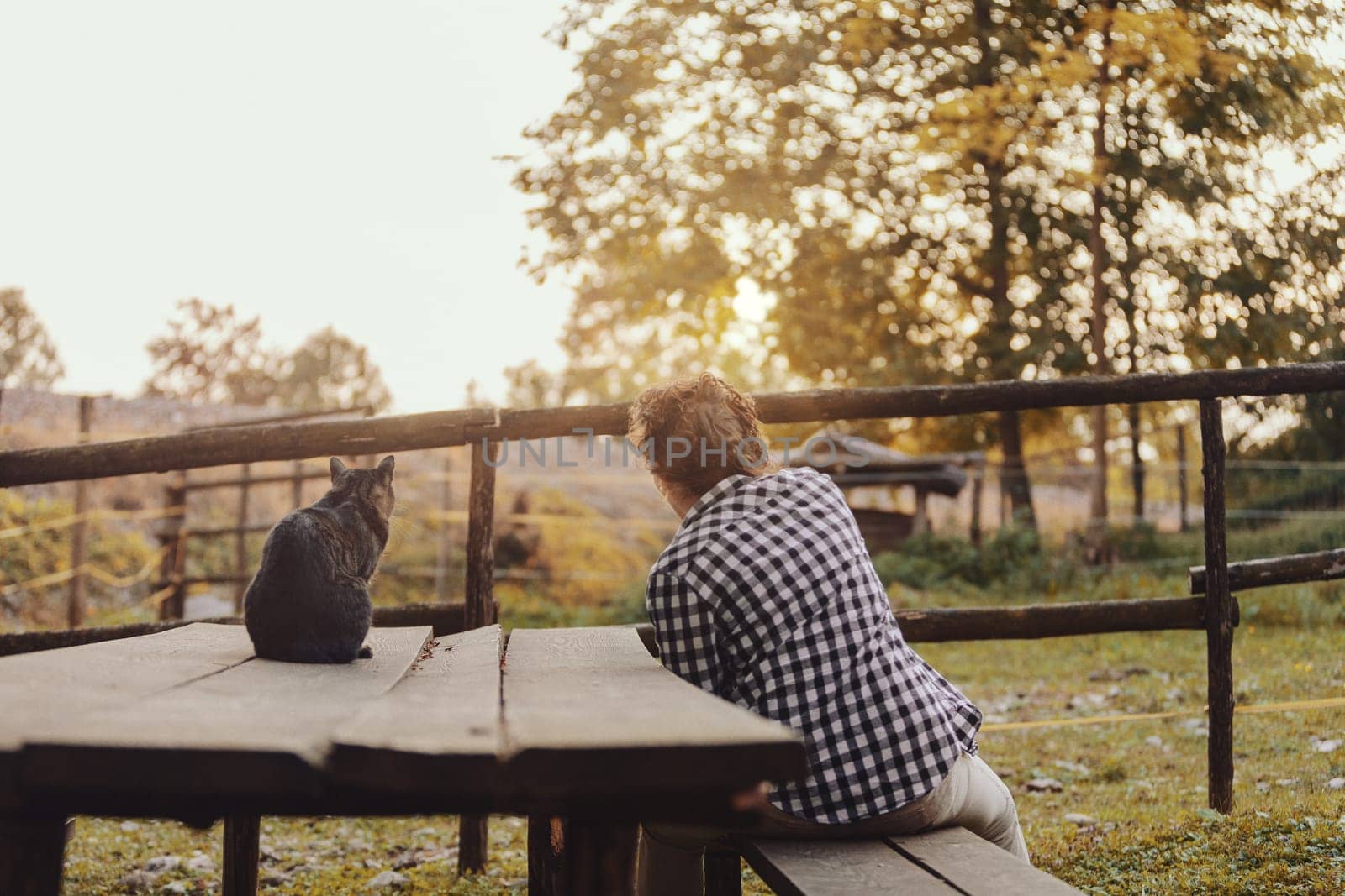 It used to be all country here, says the cat to the woman. She answers him that one day all this will be hers. Pensioners at the park of different species.