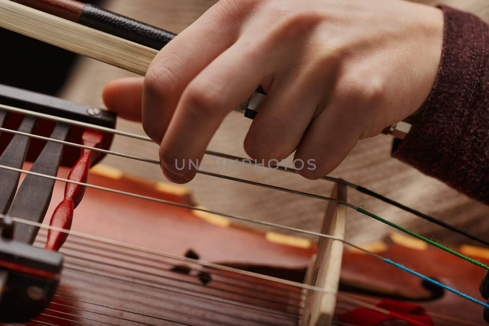 musician's intimate interaction with the Nyckelharpa, showcasing the complexity and beauty of this historical instrument
