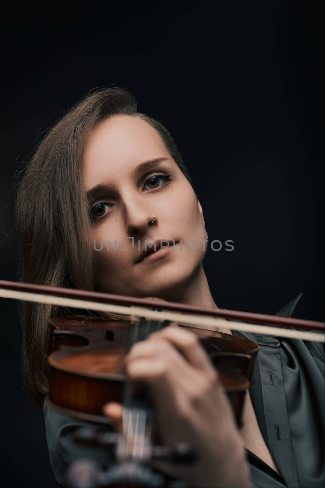 Focused musician brings to life the unique timbre of a Baroque violin, celebrating its timeless beauty