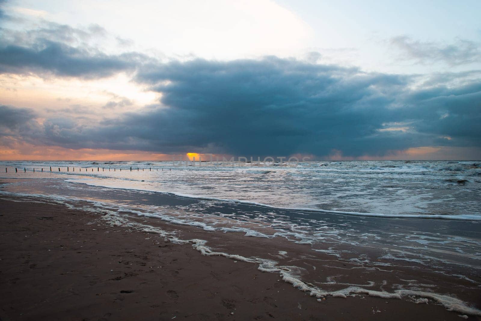 Wadden sea at low tide, North sea beach landscape, coast on Romo island in Denmark at sunset, vacation und lifestyle