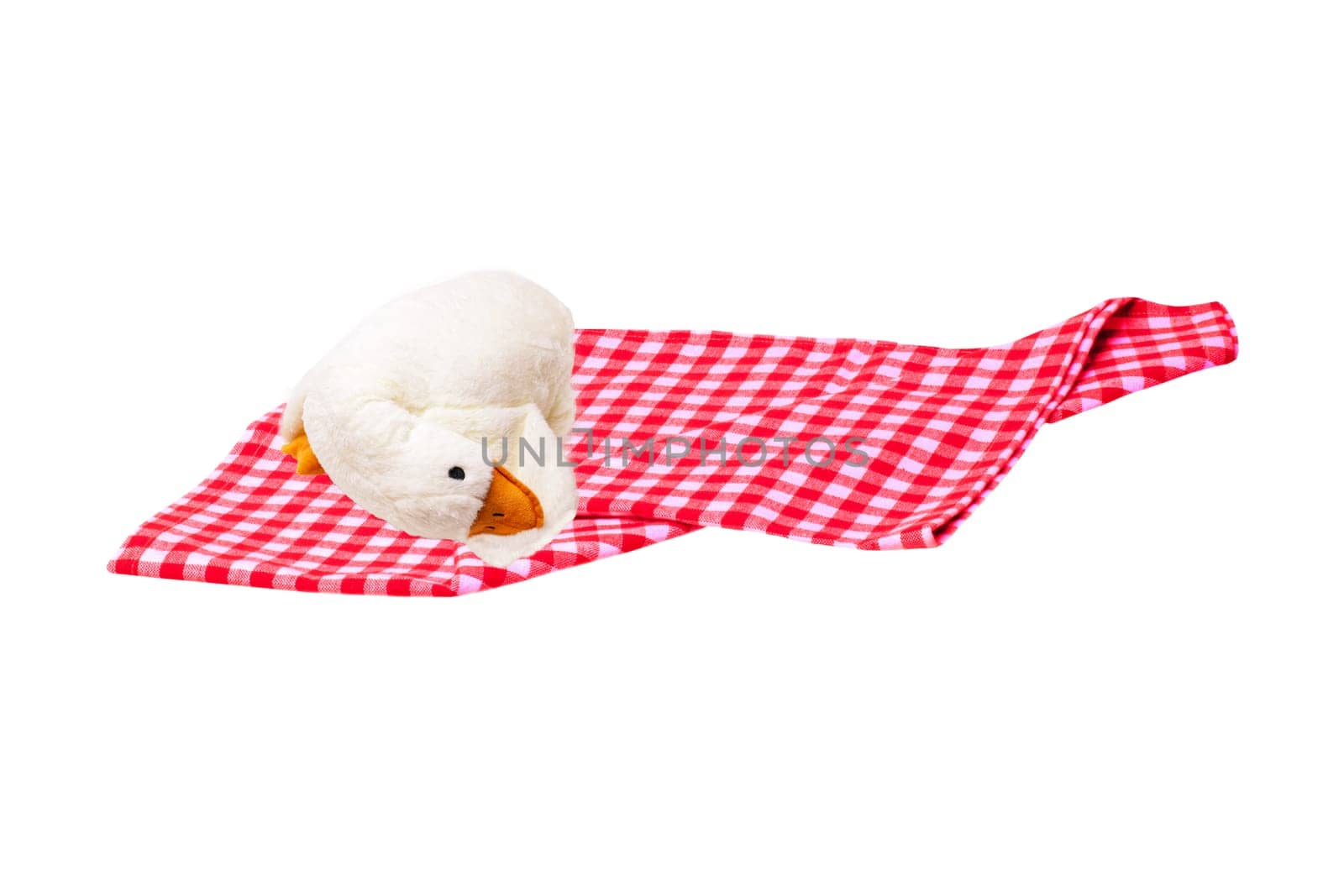 Red picnic cloth. Red checked picnic blanket with a plush toy duck for kids on it isolated on a white background. Copy space.