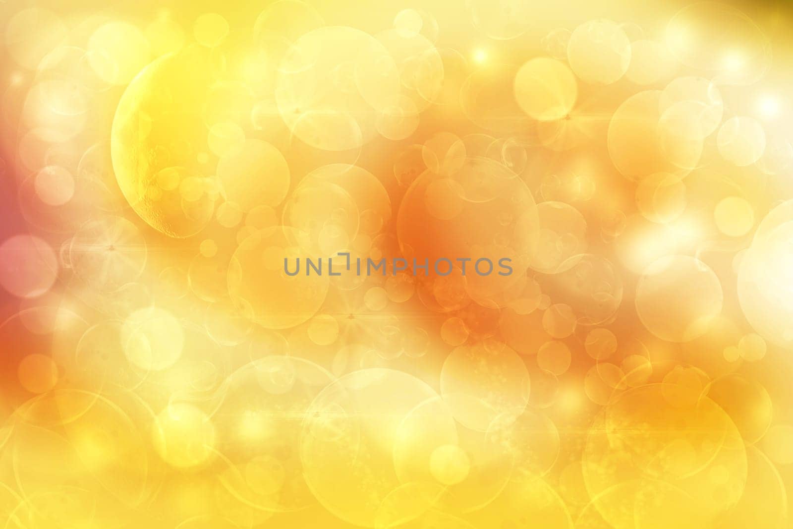 A festive abstract delicate golden yellow red orange gradient background texture with defocused bokeh circles. Card concept for Happy New Year, party invitation, valentine or other holidays.