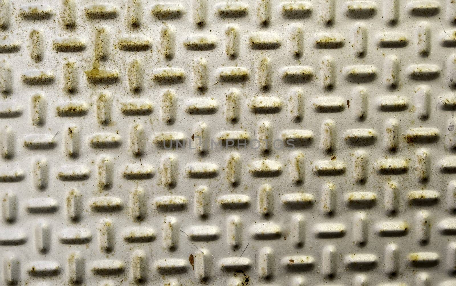 Detail of a rough and rusty metal plate due to the passage of time