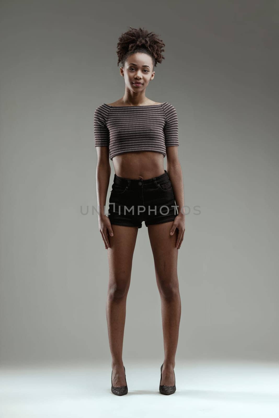 Elegance and style captured in a woman's casual yet fashionable stance