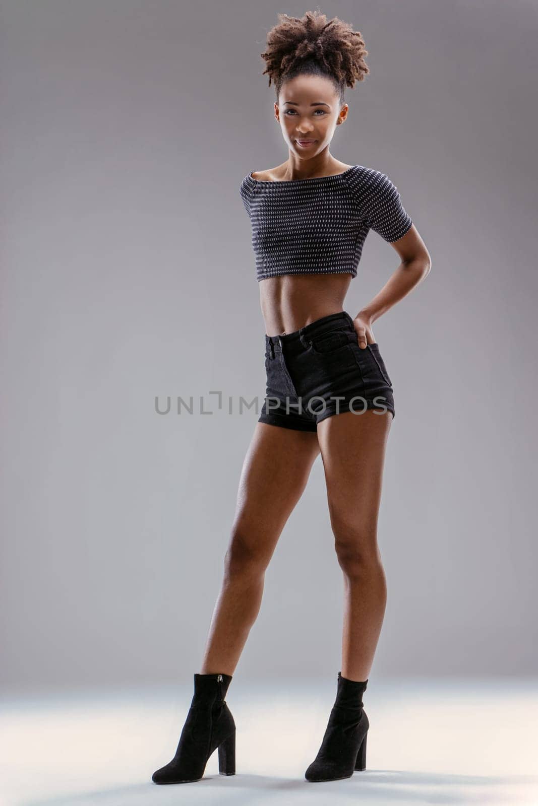 Effortless grace is defined by her stance, accentuating her beauty