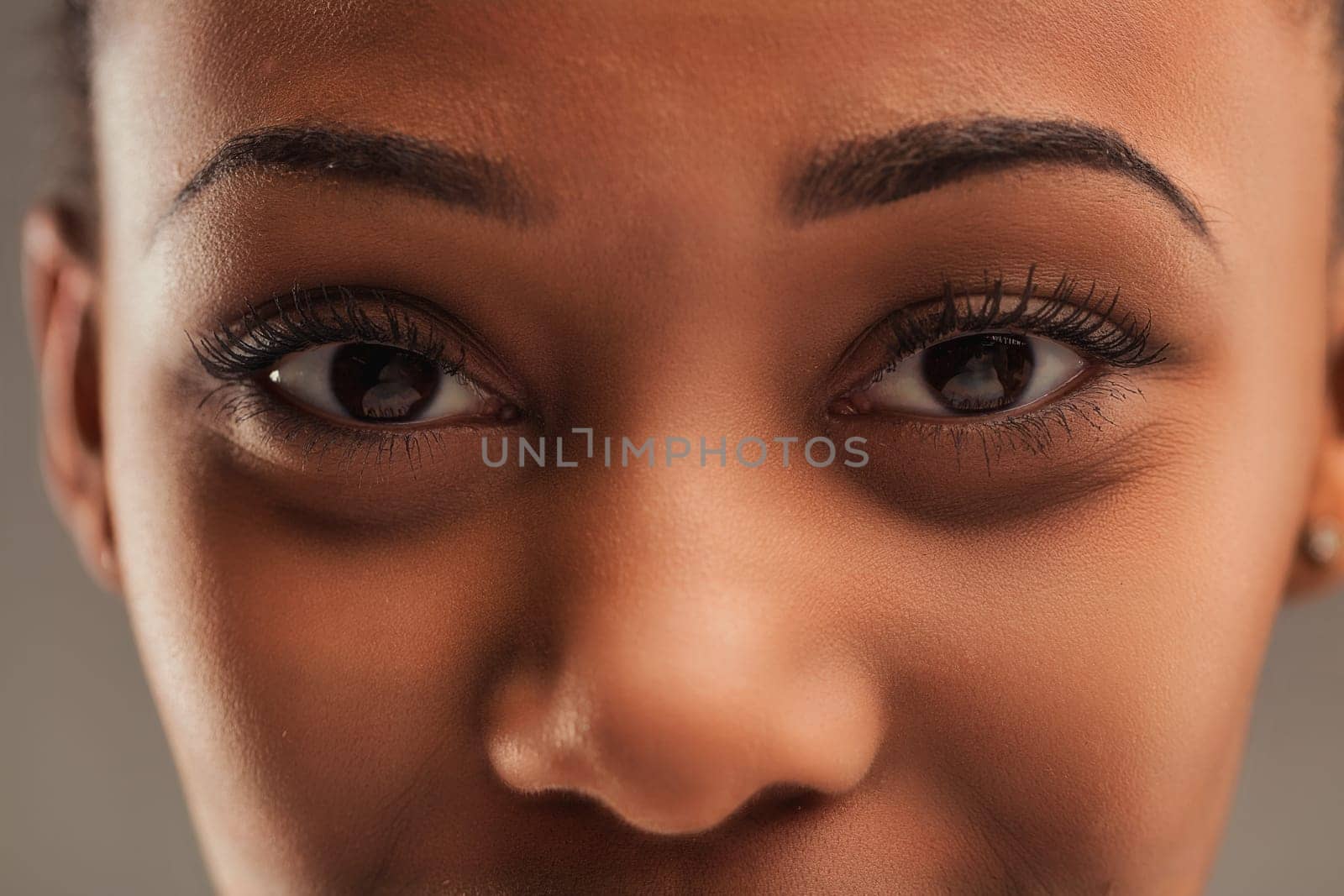 Intense close-up of a woman's eyes, detailed with perfectly applied makeup, showcasing depth and emotion