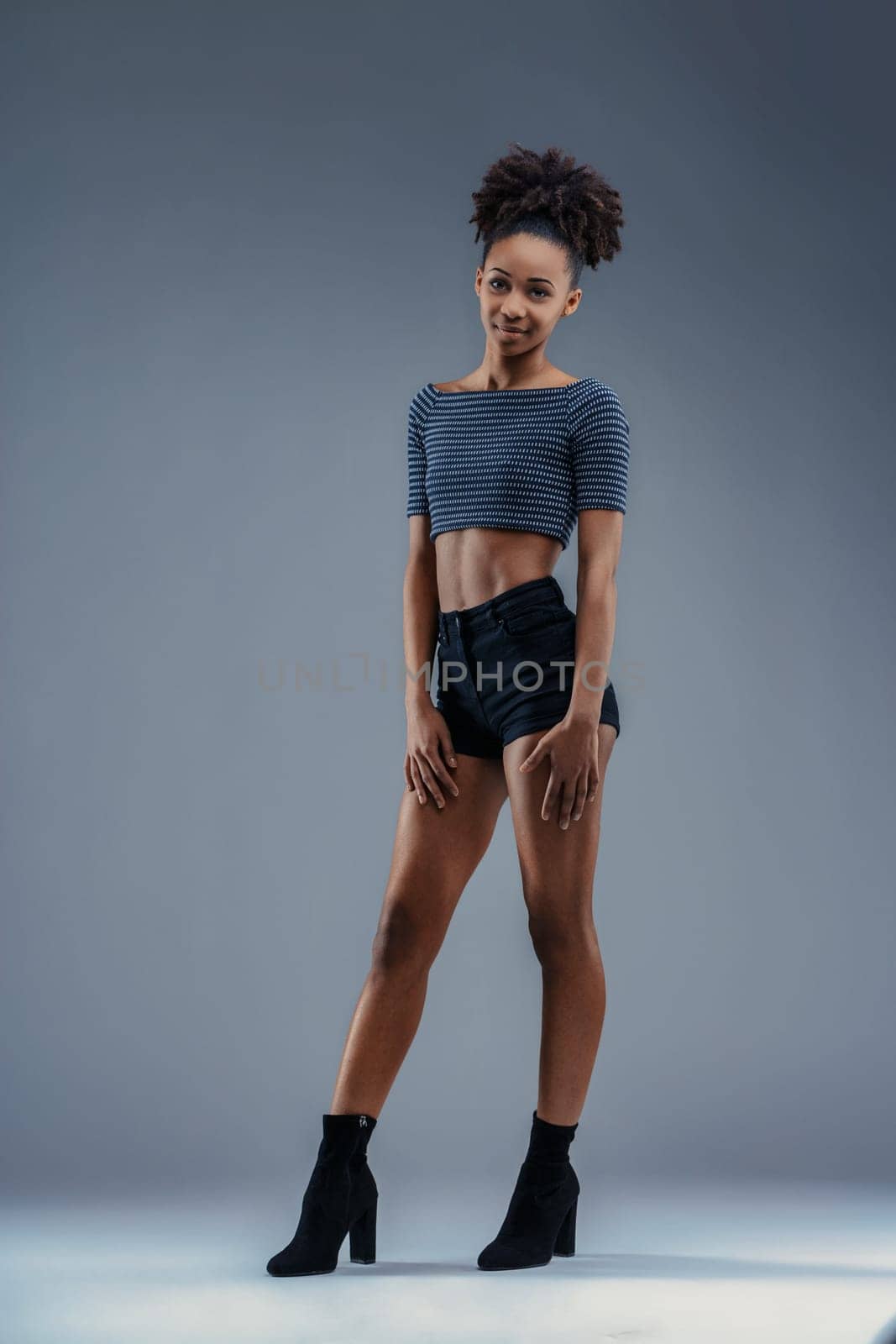 Casual yet poised, her presence commands the space with subtle strength