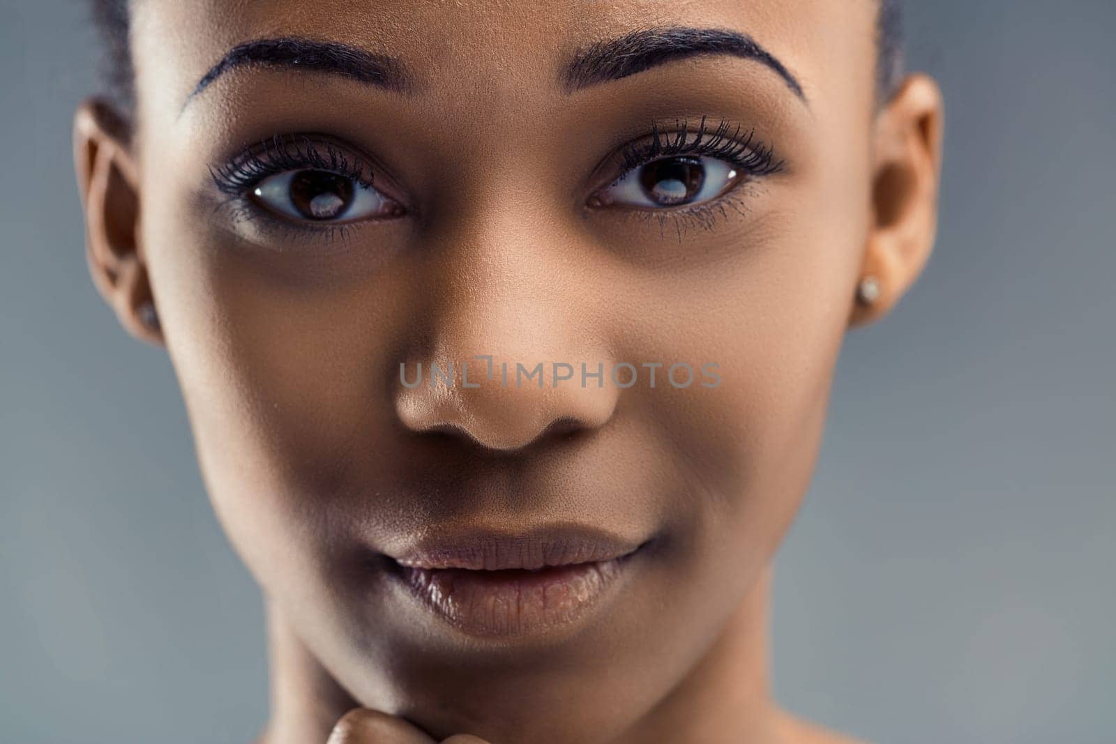 Detailed portrait of a young female with keen eyes and a soft smile
