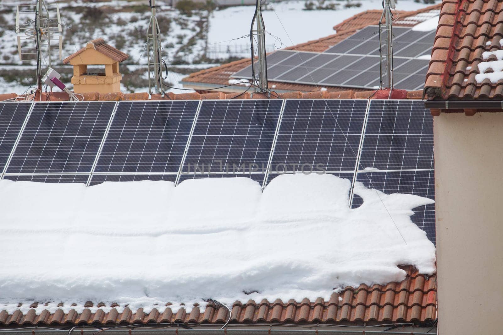 Roof solar panels covered with snow. Solar panels after snowstorm